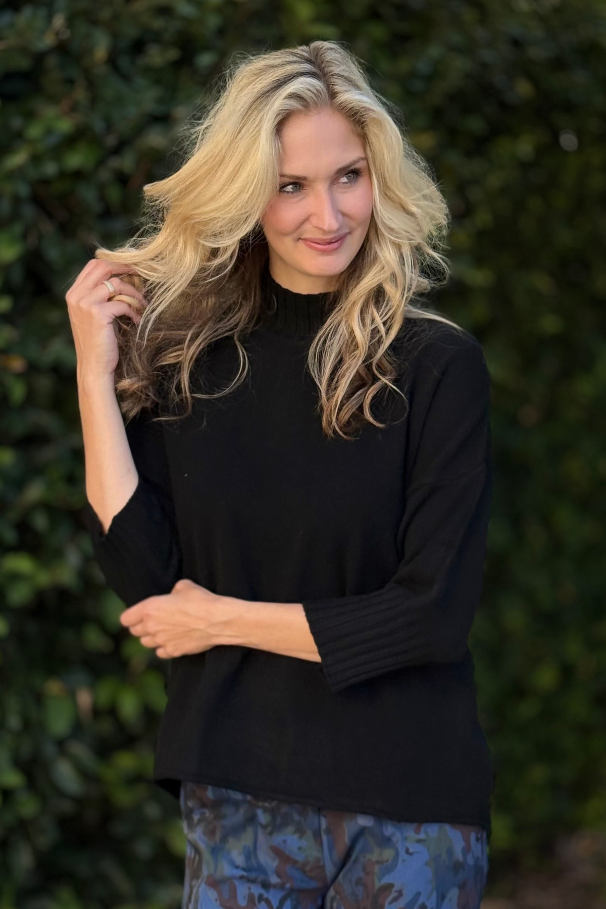 Relaxed fit black sweater with ribbed trim