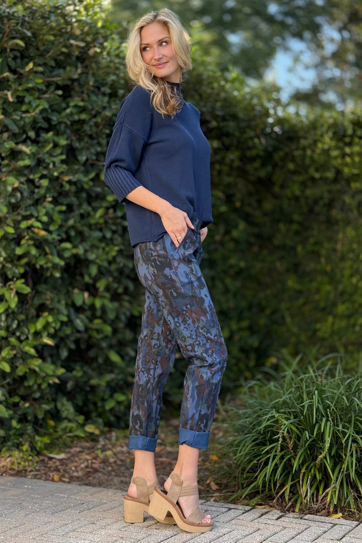 Relaxed fit navy patterned pants styled with navy sweater