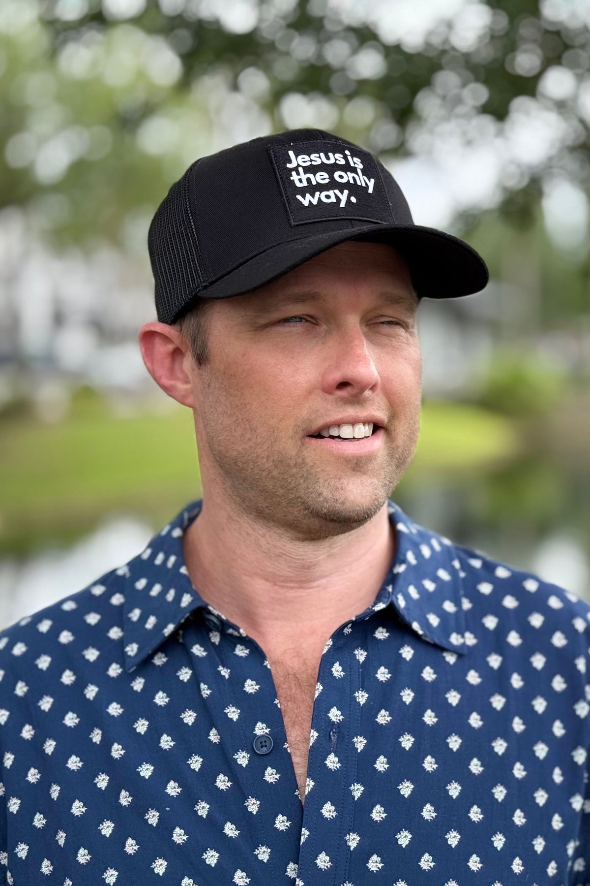 Man wearing ballcap outside