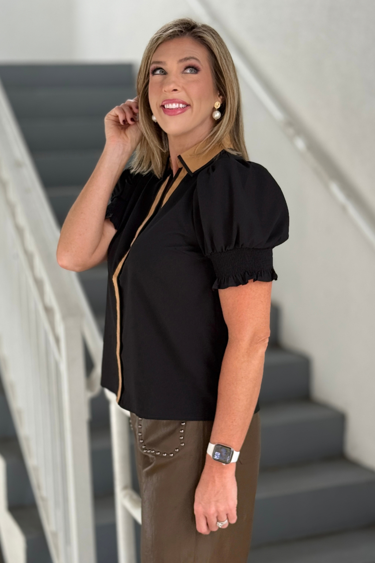 Black puff sleeve top with smocked ruffle cuffs