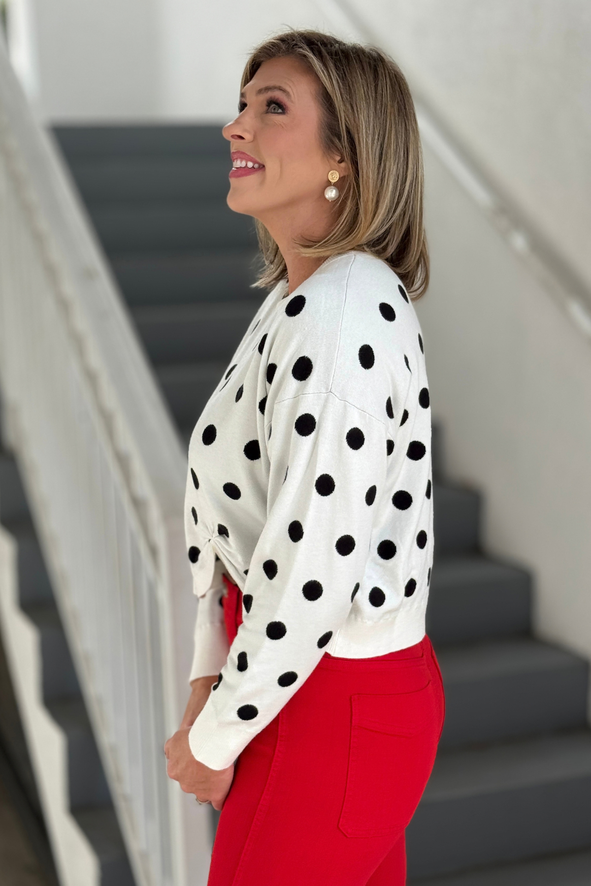 Women’s black and ivory polka dot knit sweater