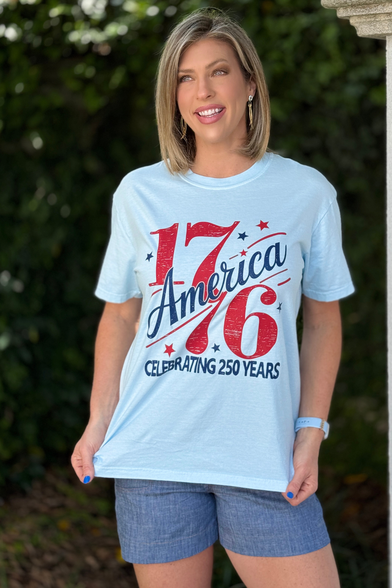 patriotic red white and blue 1776 t-shirt flat lay with denim shorts
