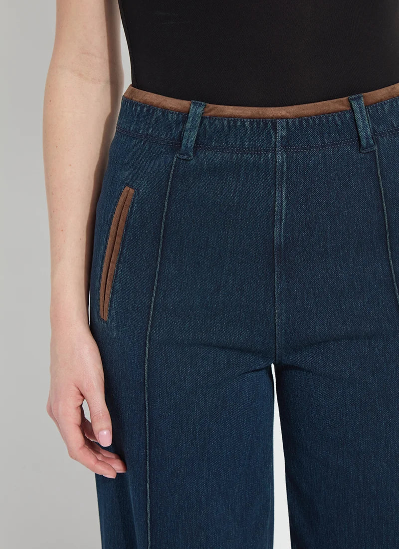 Dark indigo cropped denim pants with relaxed leg and patch pockets