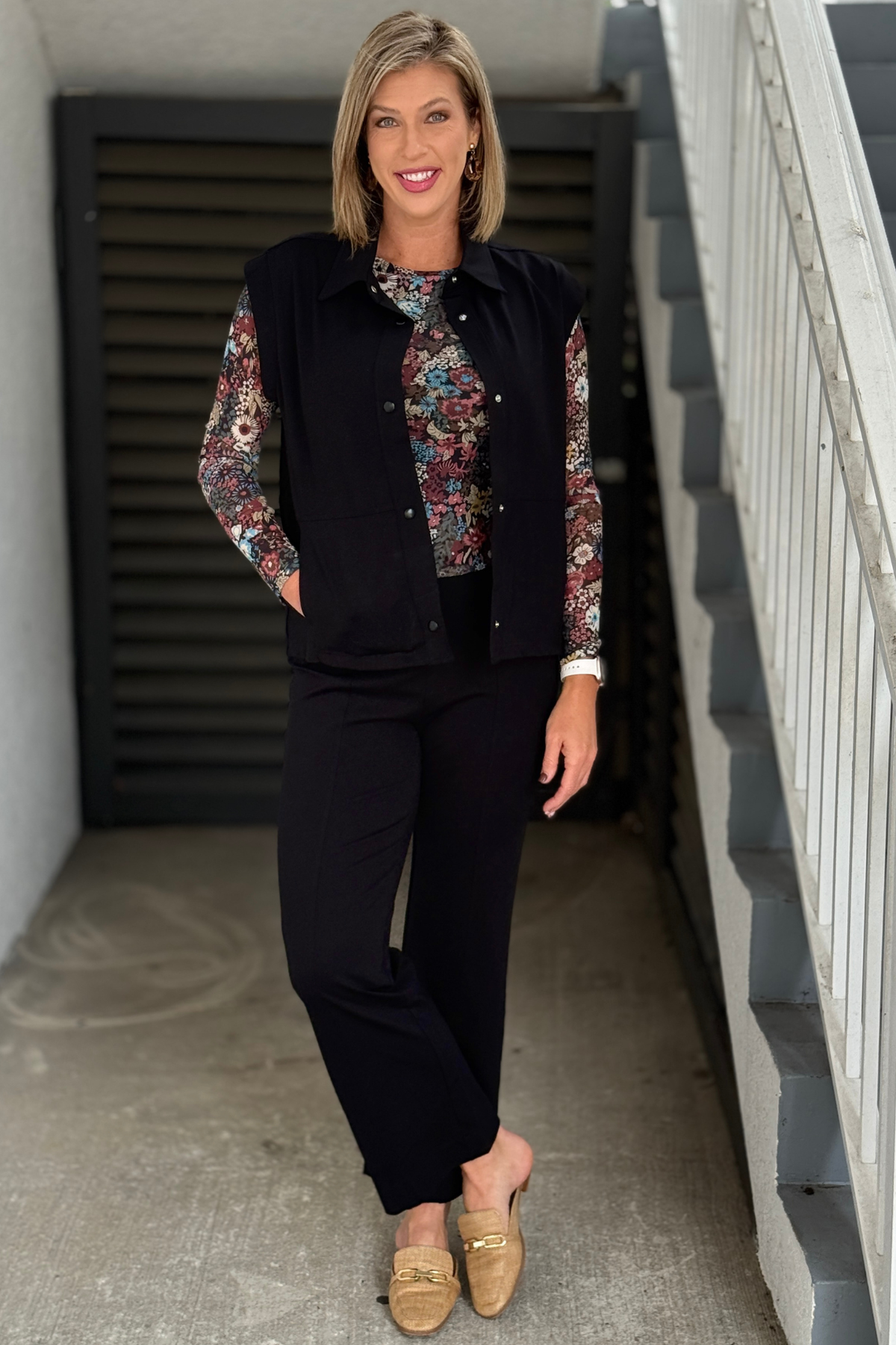Women’s black pull-on wide leg pants styled with a floral top
