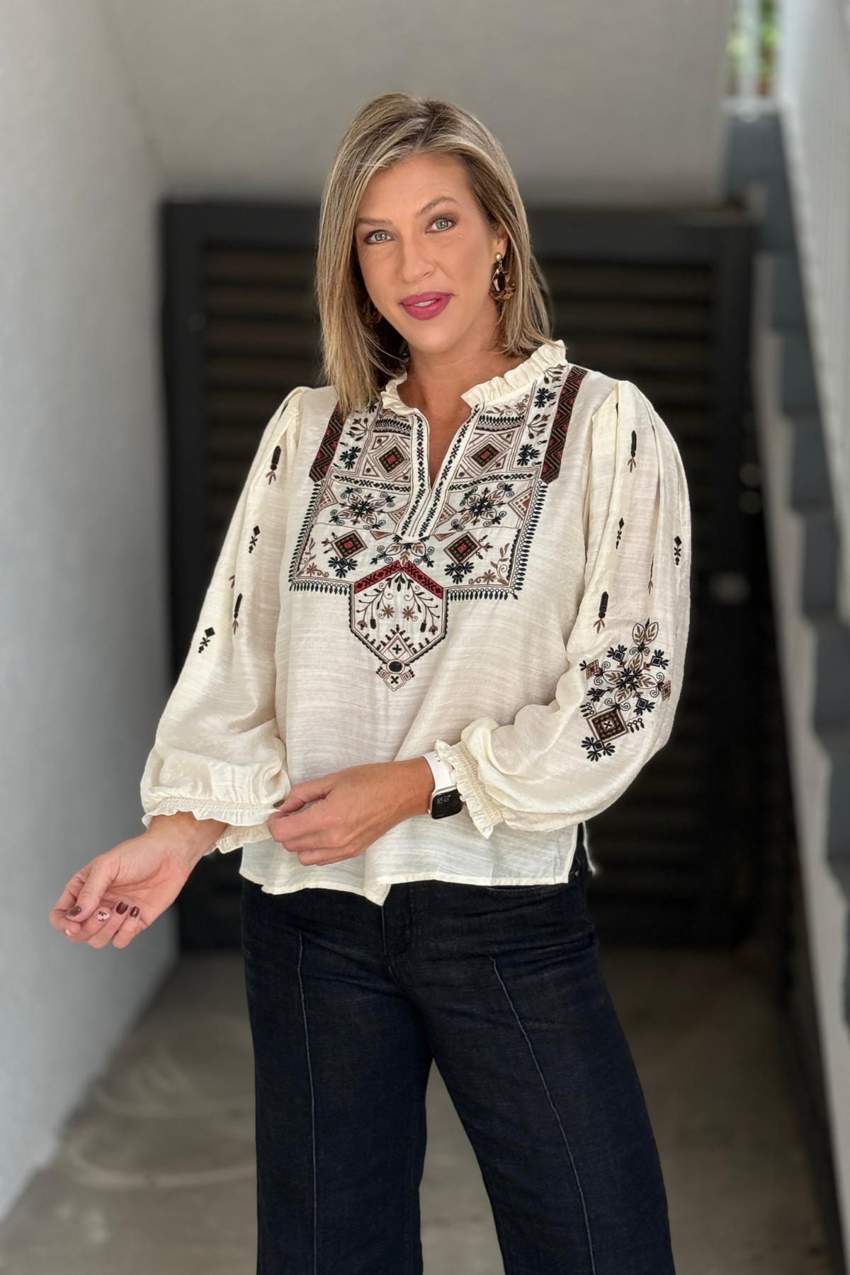 A La Carte cream popover top with detailed embroidered bib and long sleeves