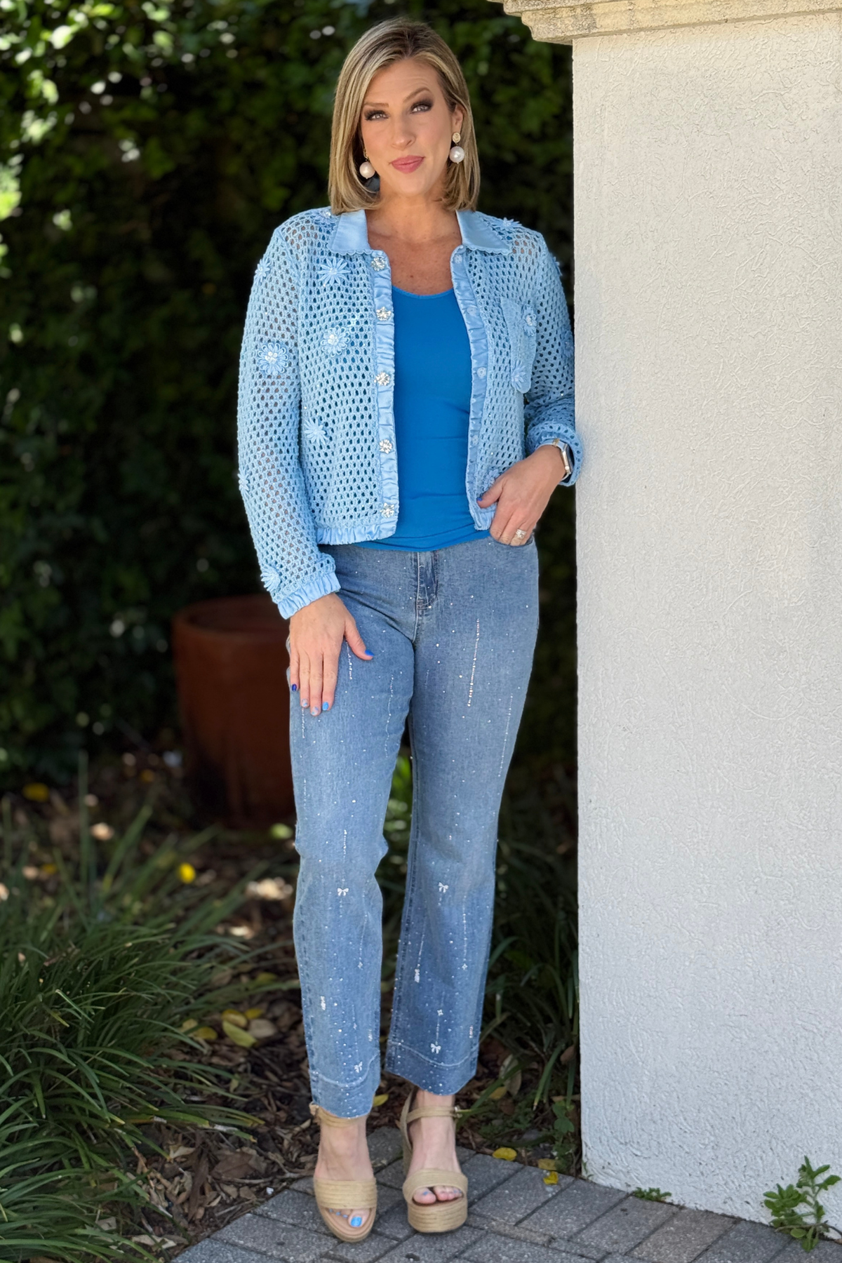 mid rise jeans with love detail close up
