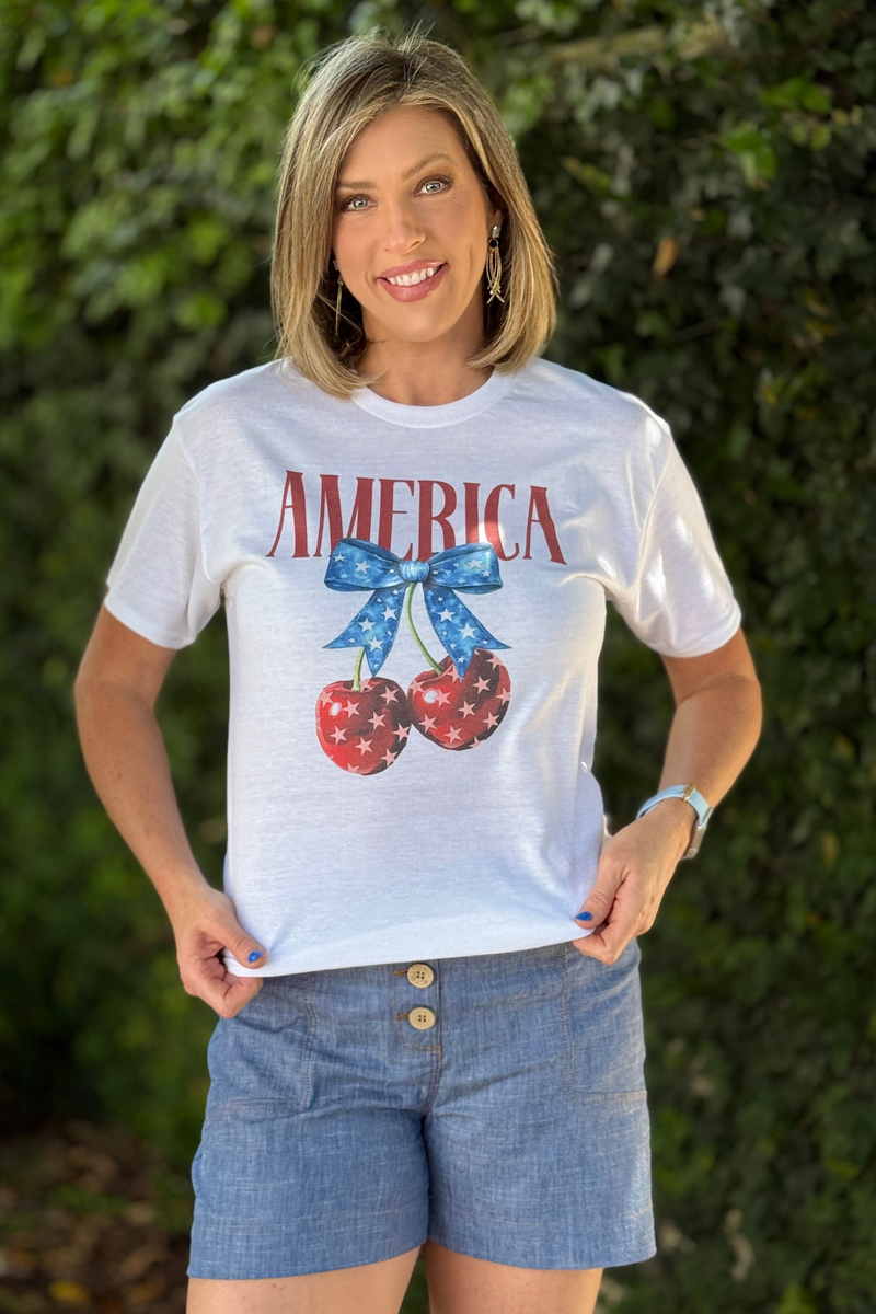 white patriotic t-shirt with red America text and star cherries