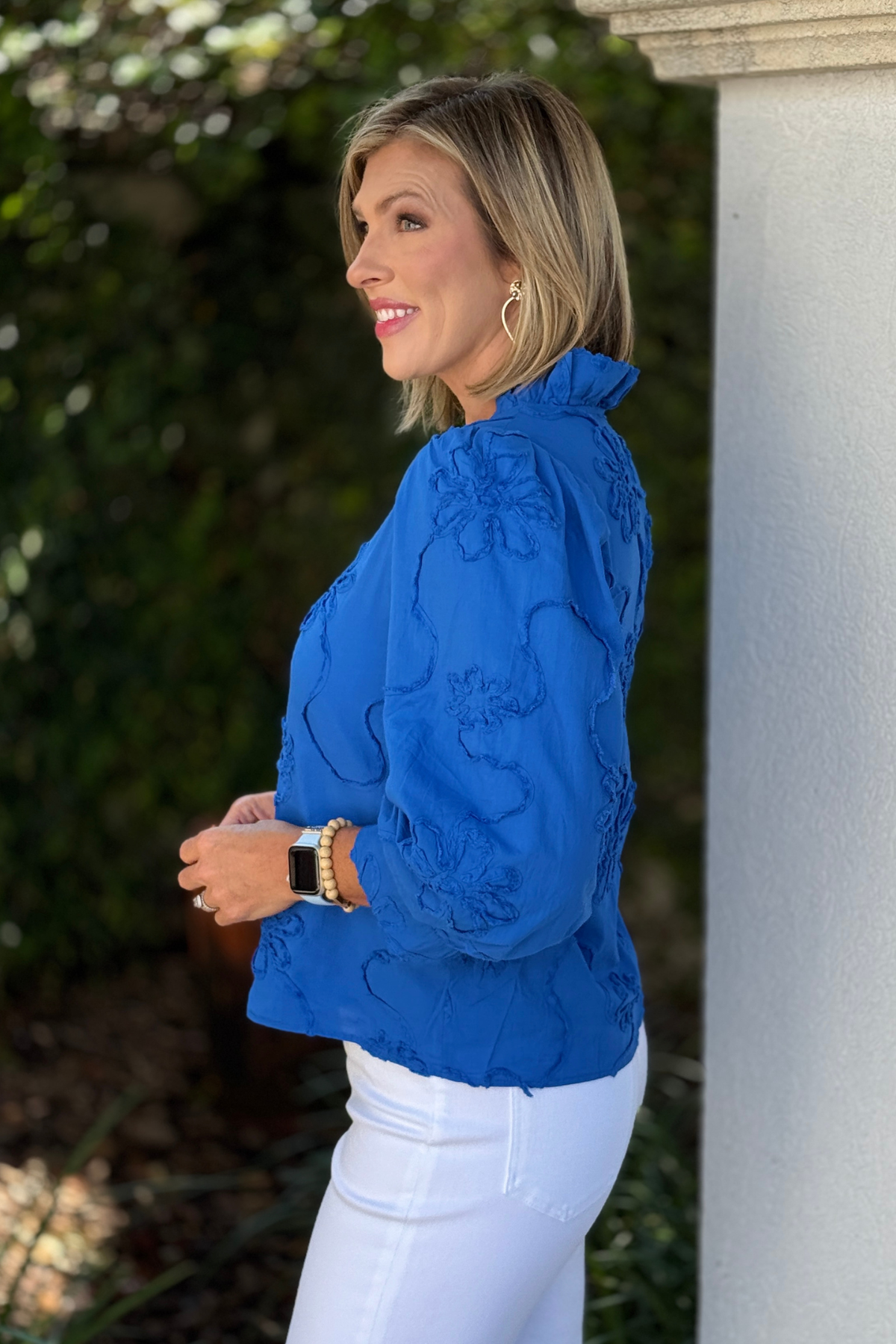 Back view of royal blue textured floral cotton top