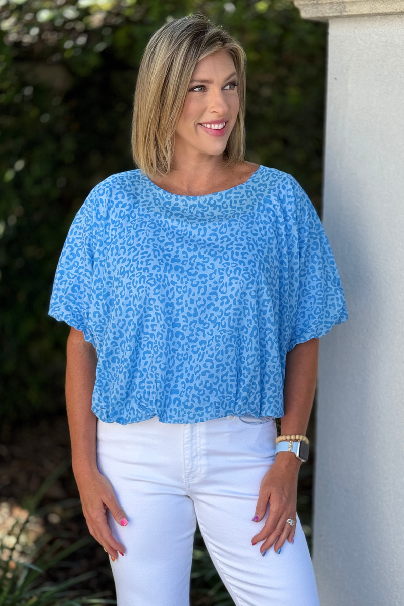 Baby blue tonal leopard print top styled with white denim