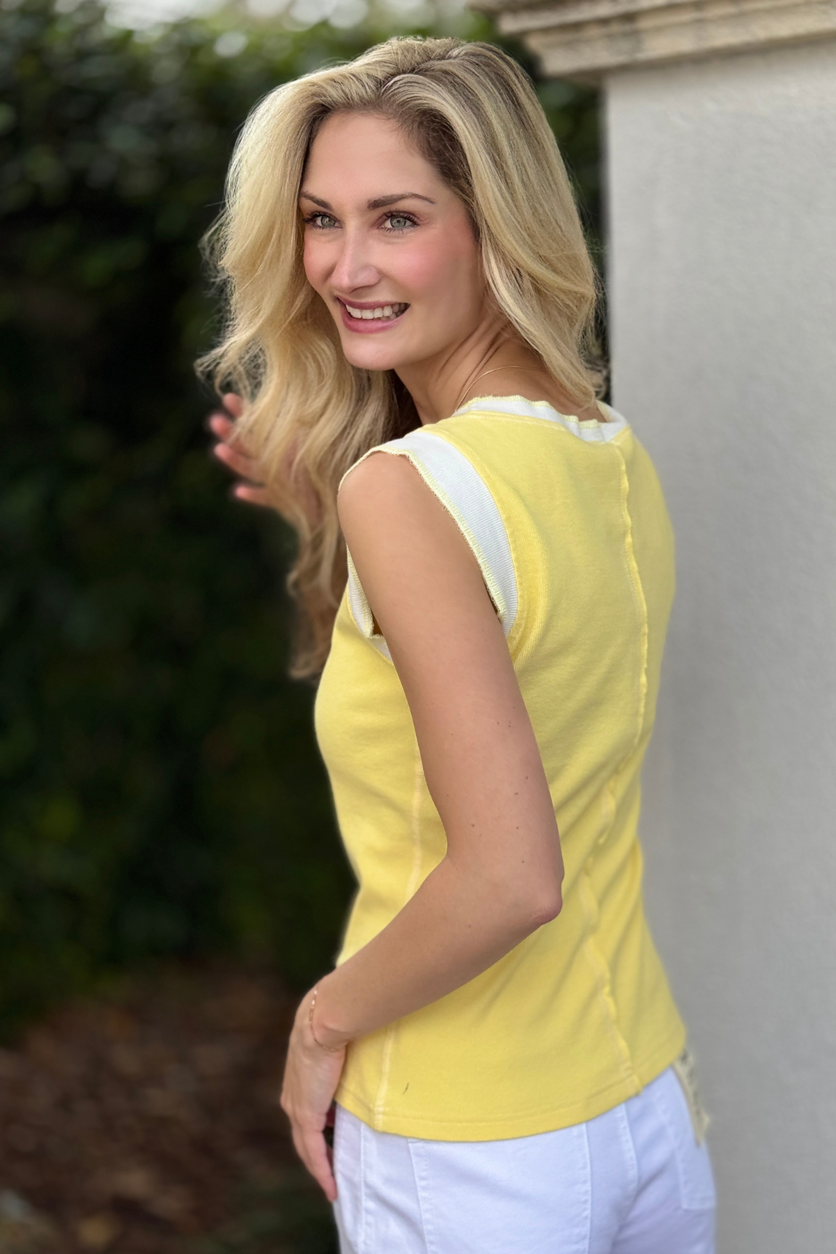 Bright yellow fitted tank styled for spring