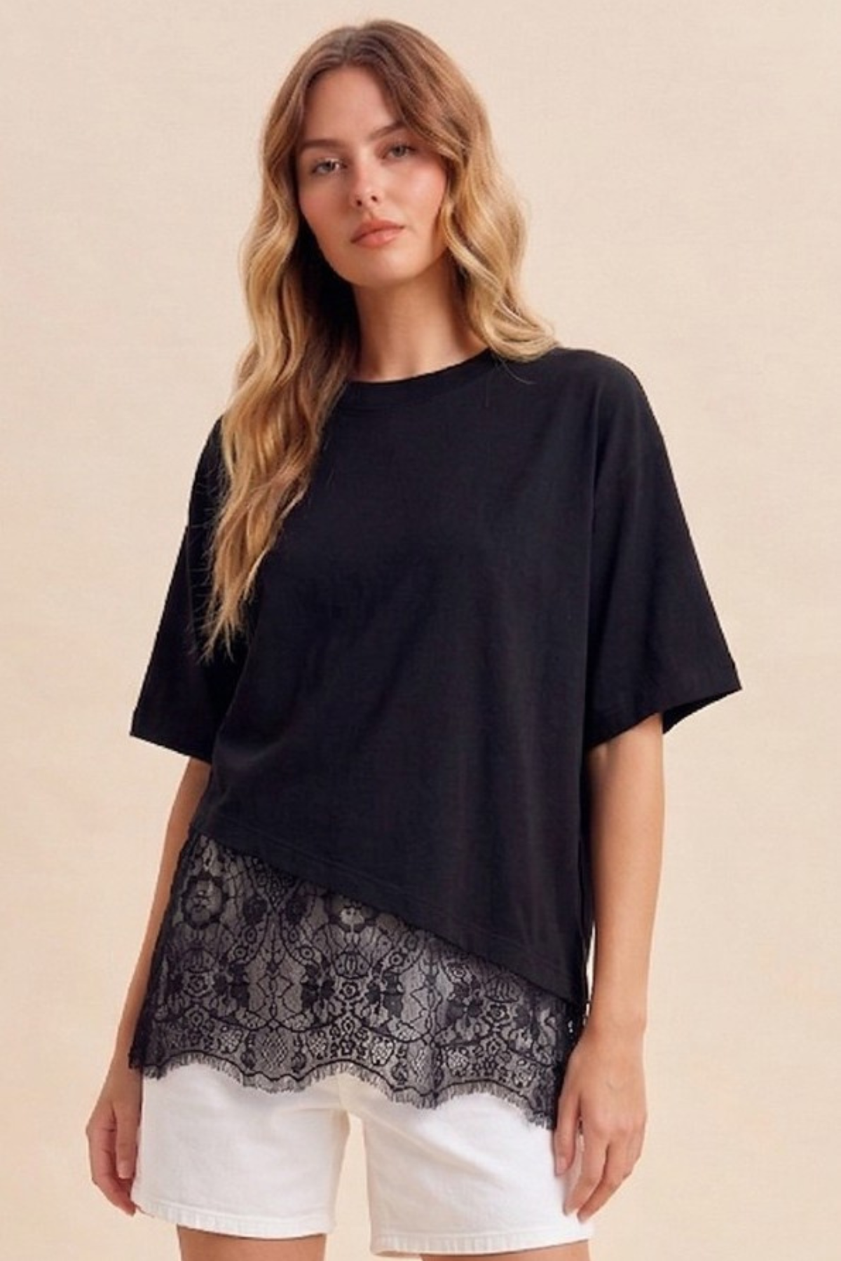 Feminine black crew neck tee with lace hem