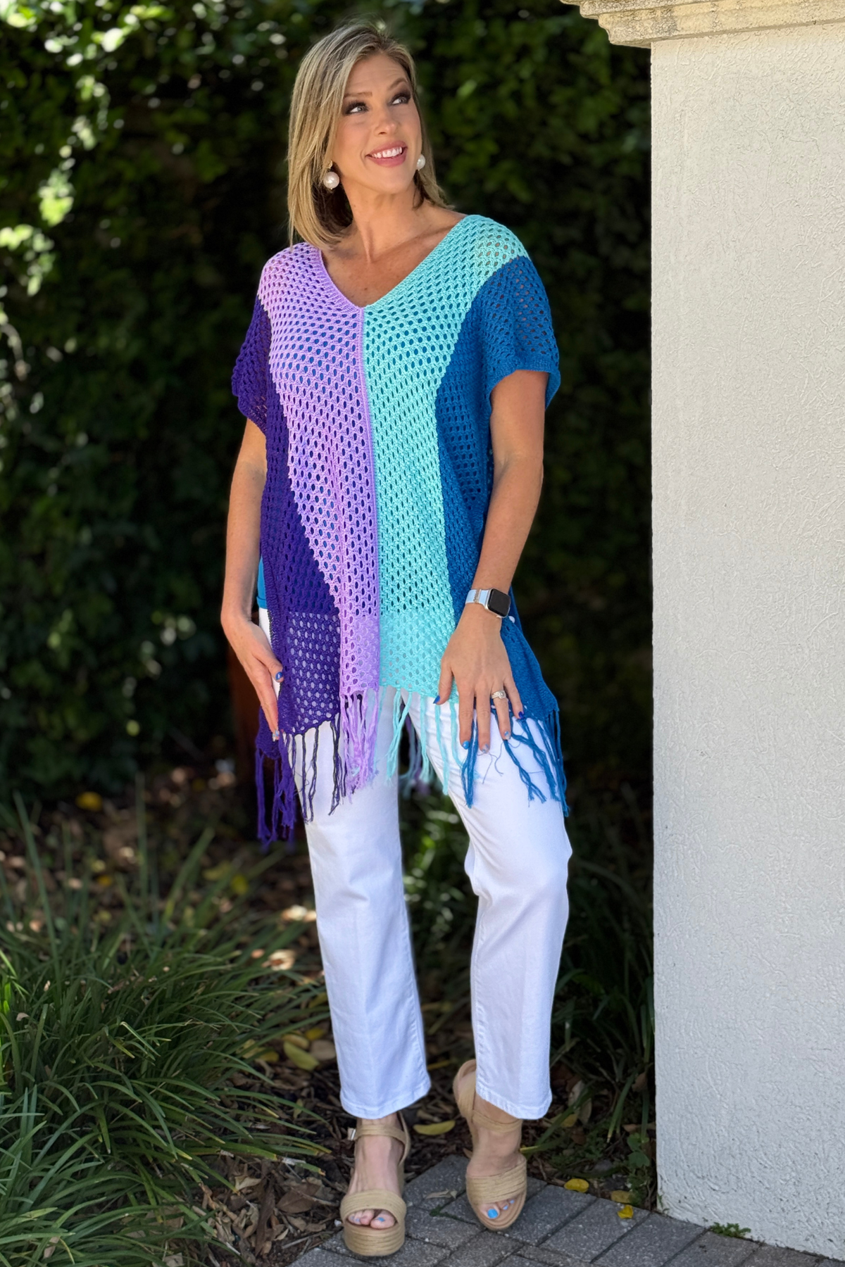 colorful summer crochet top styled with white jeans