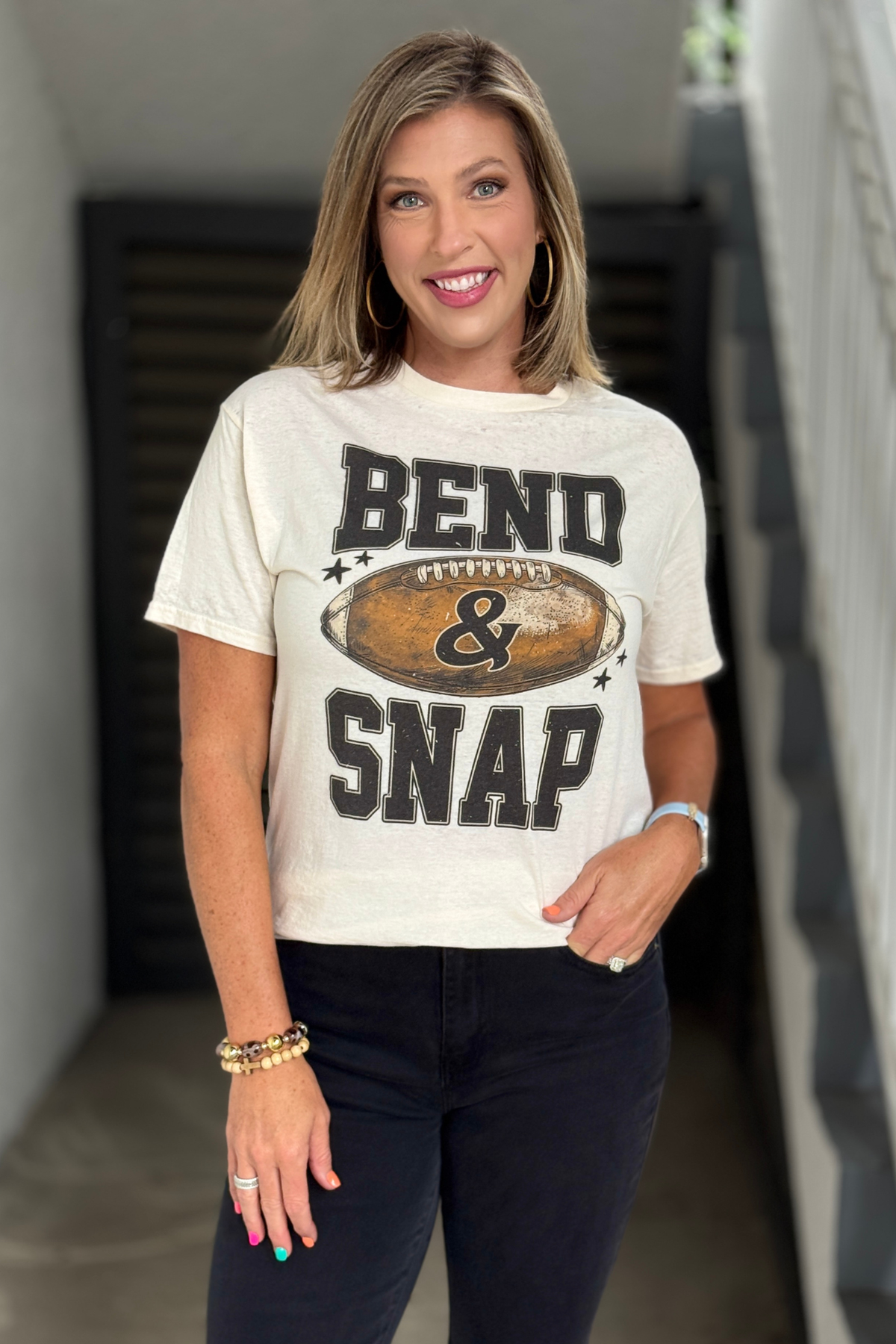 Bend and Snap football graphic tee for women