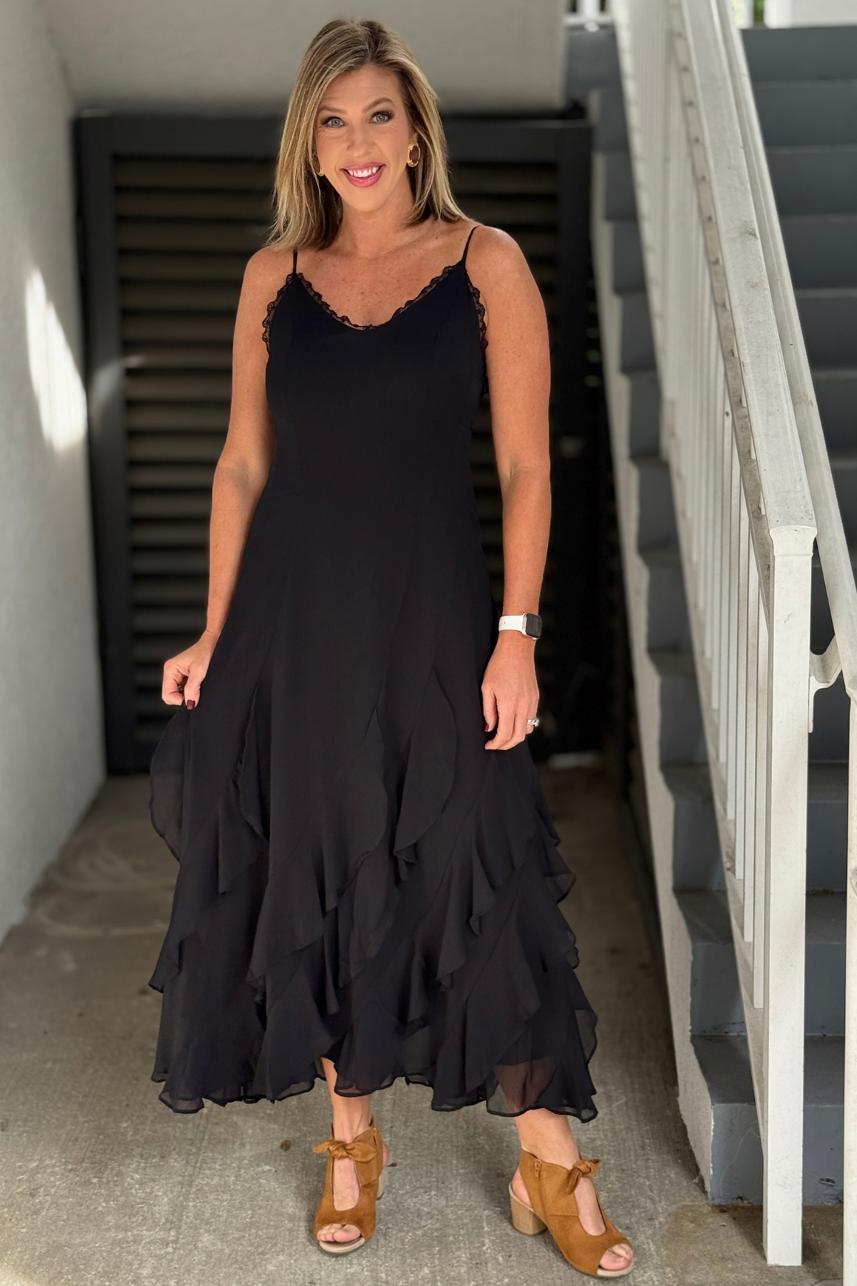 Black high-low maxi dress with layered ruffle skirt