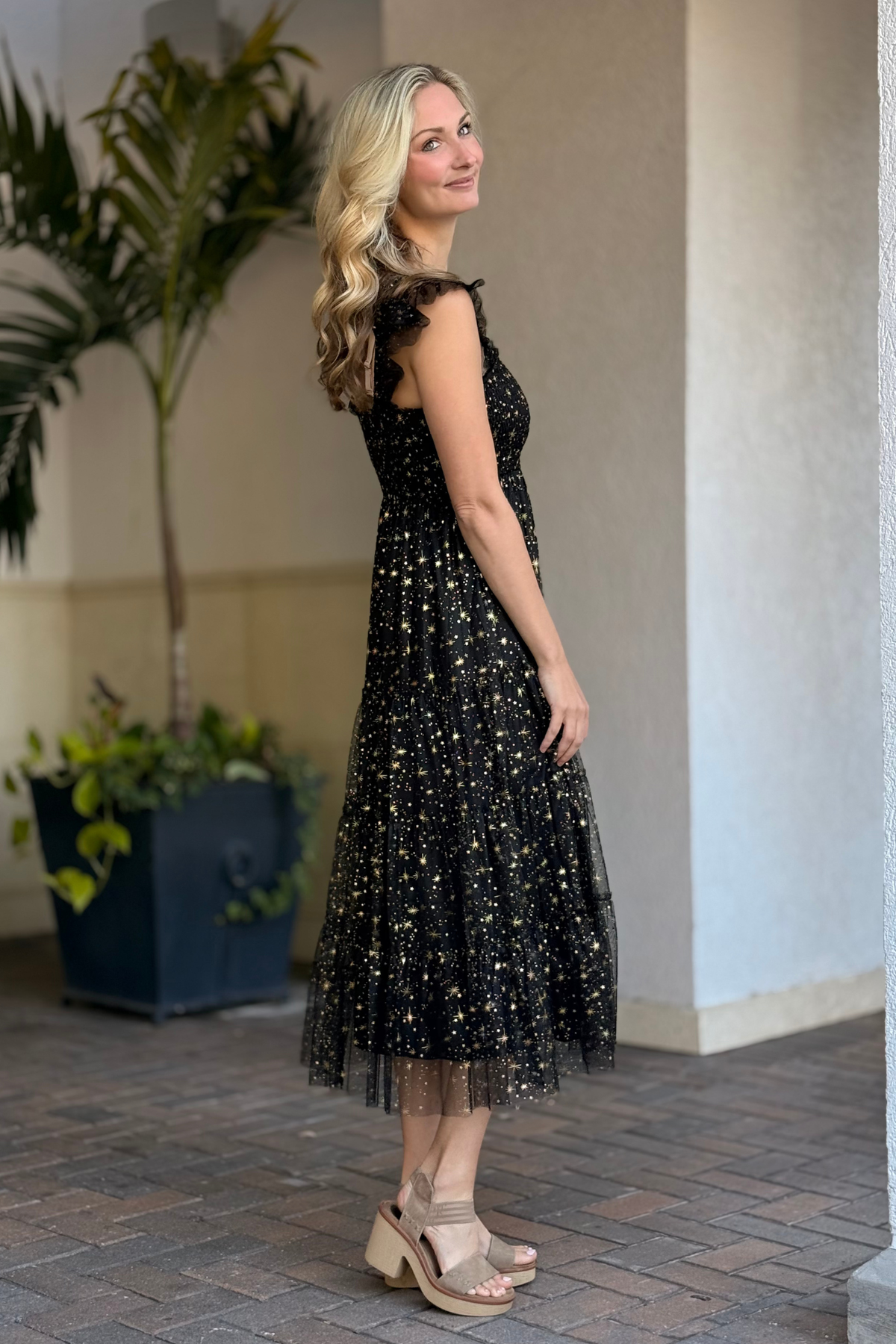 Celestial themed black mesh dress styled for holidays