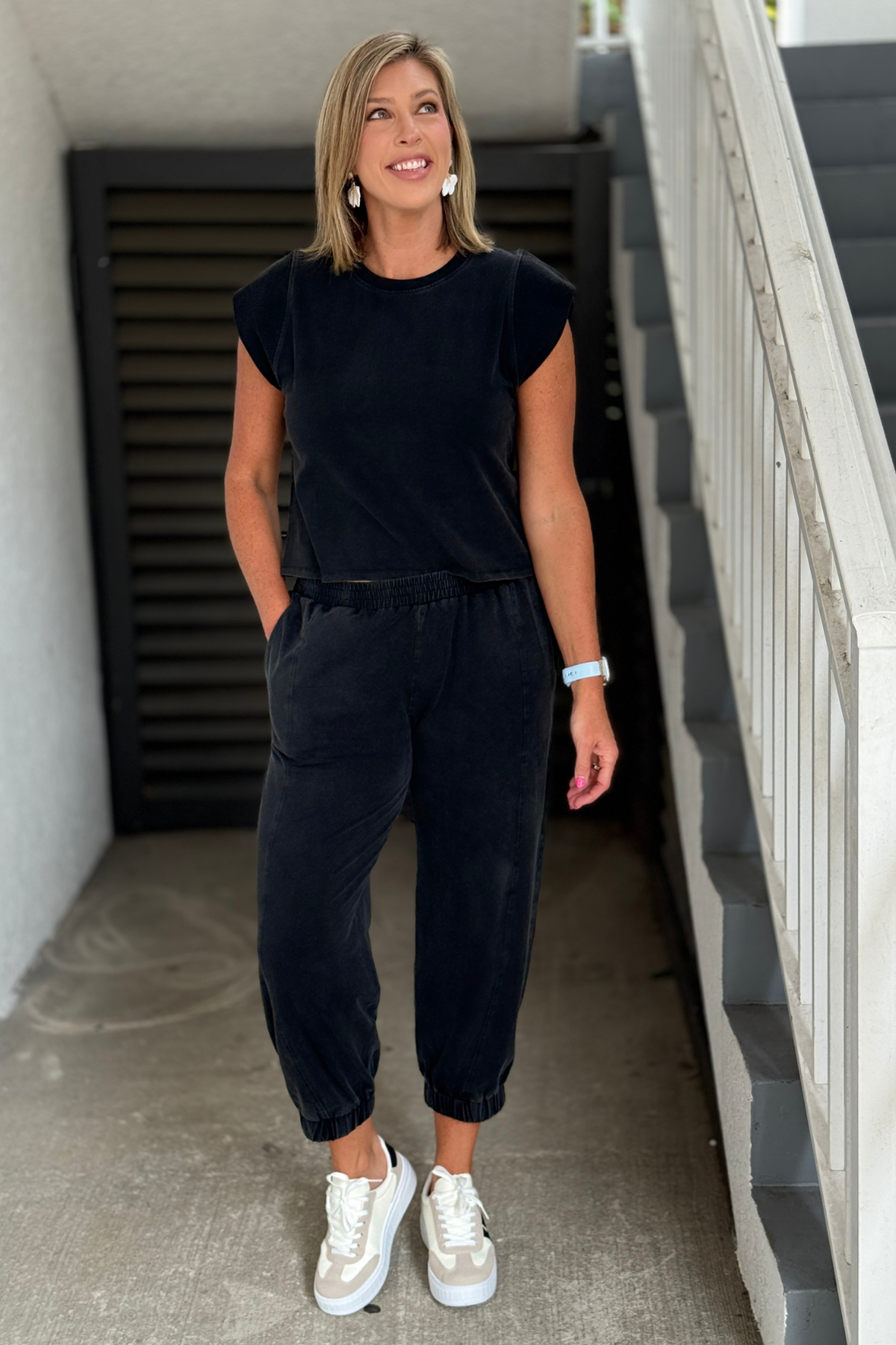 Woman wearing ash black jogger set with cap sleeve top