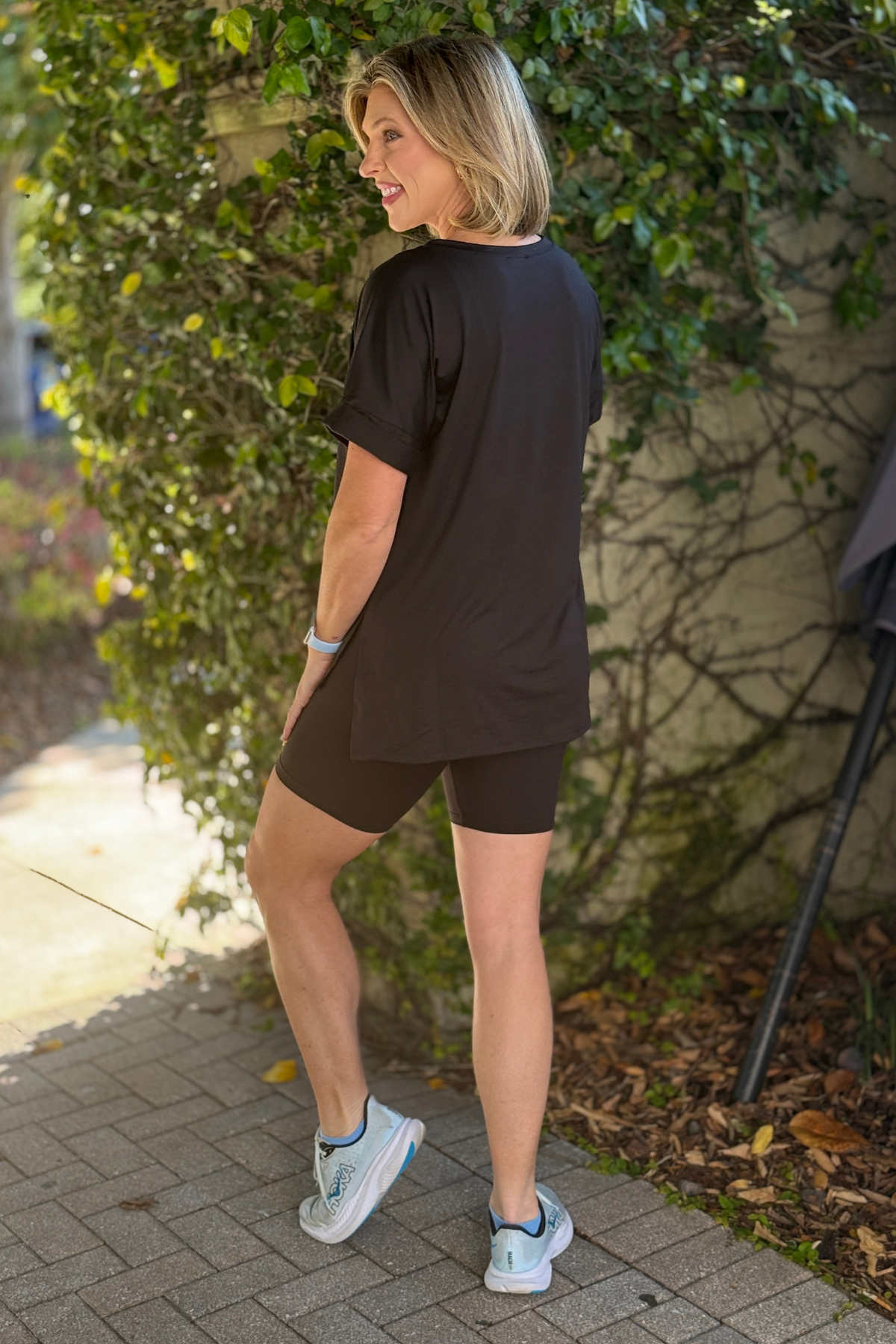 soft black biker shorts set styled with sneakers