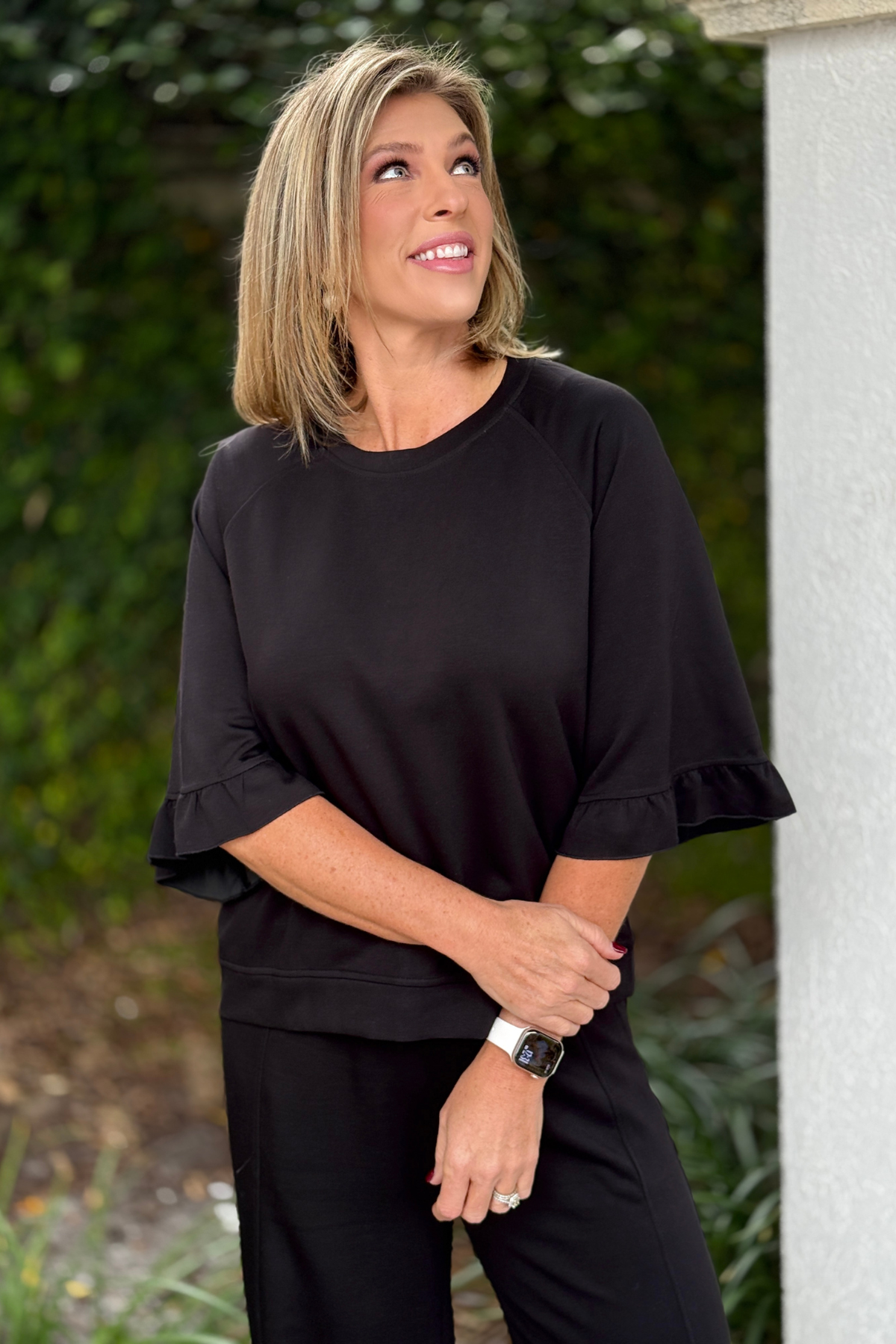 Black wide leg matching set styled with sneakers