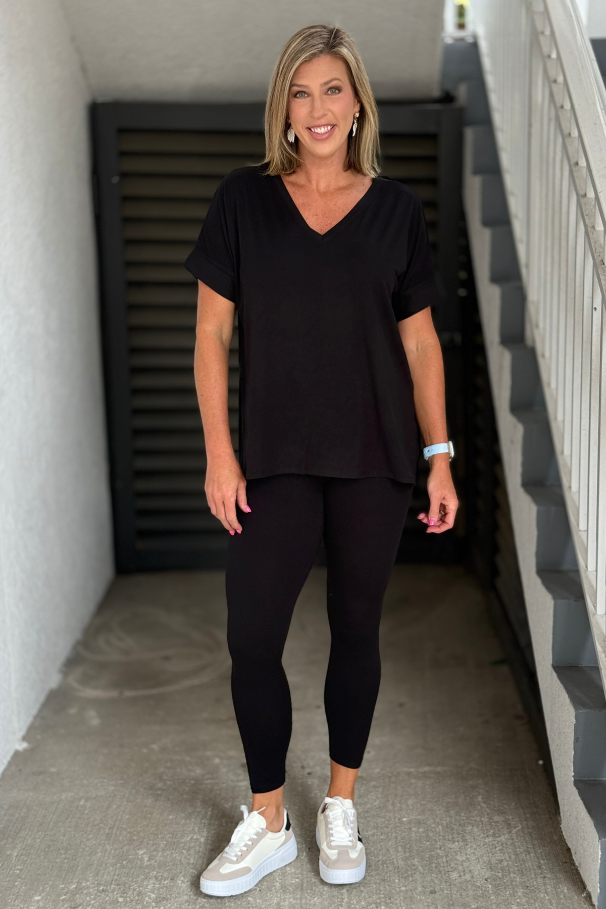 Front view of black V-neck lounge set