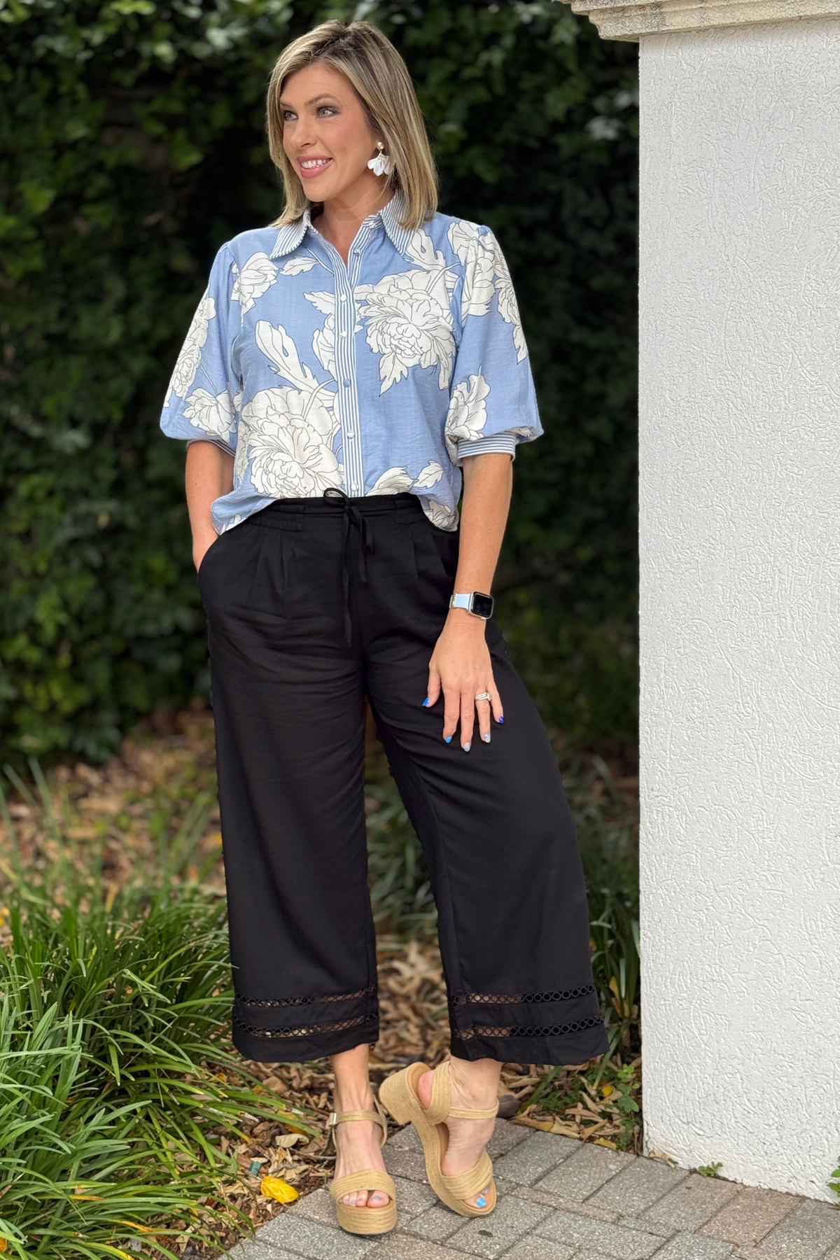 Black cropped wide leg pants with elastic waistband and pockets