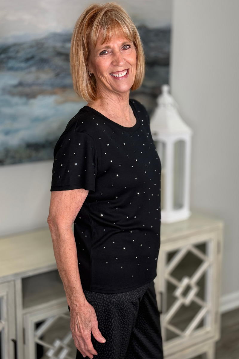 Women’s black holiday tee with scattered rhinestones and stars