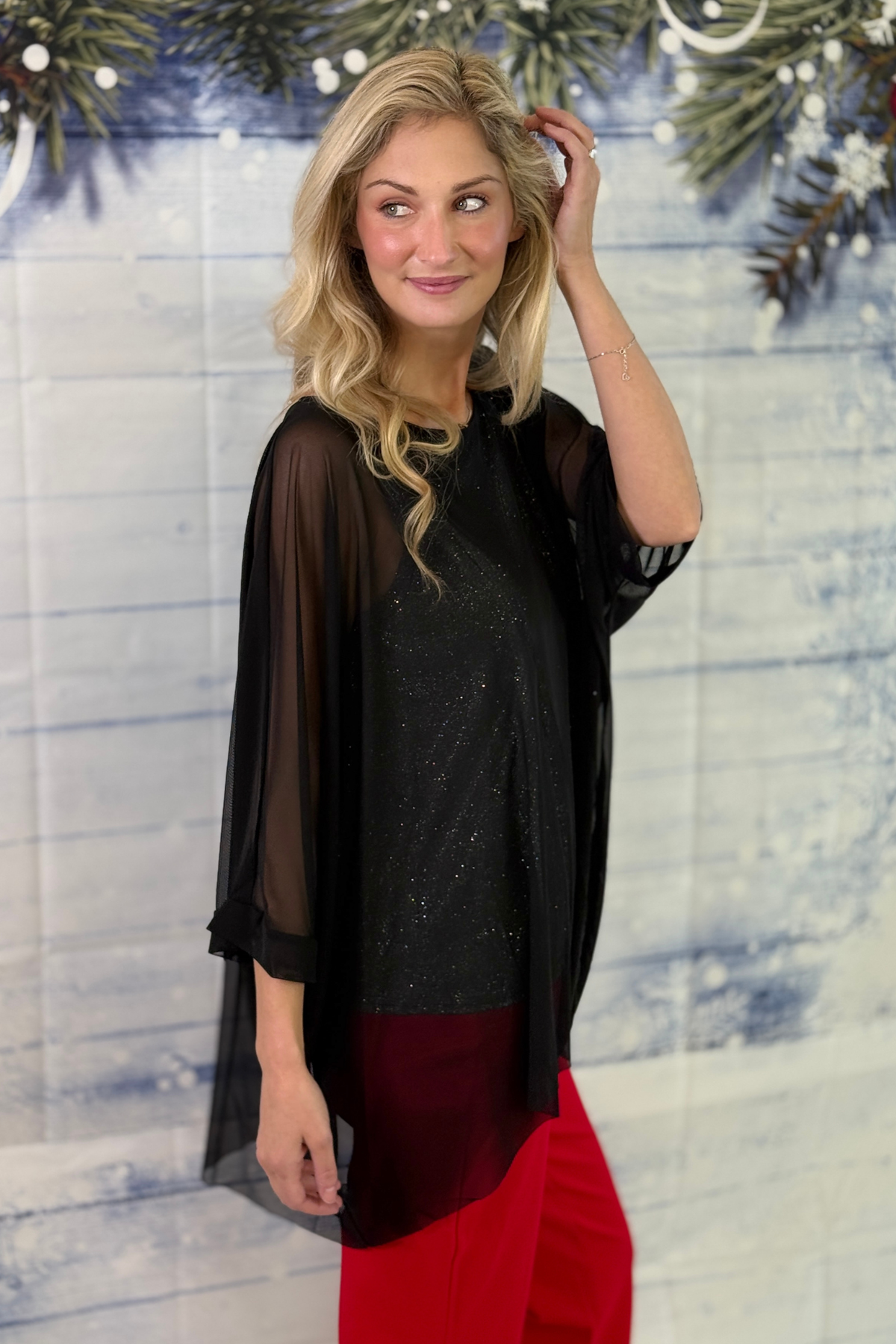 Black sparkle top styled with matching shimmer skirt