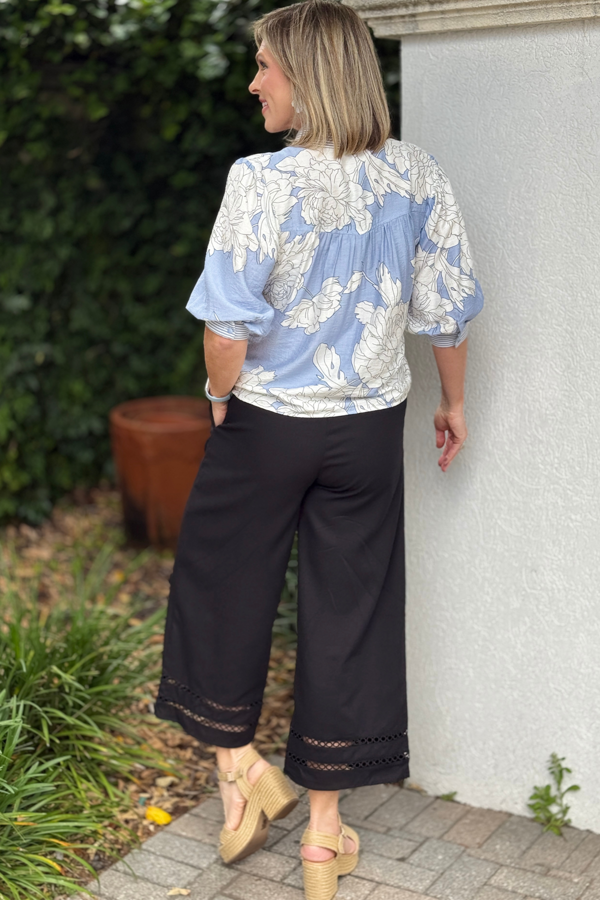 Back view of black cropped pants showing relaxed fit