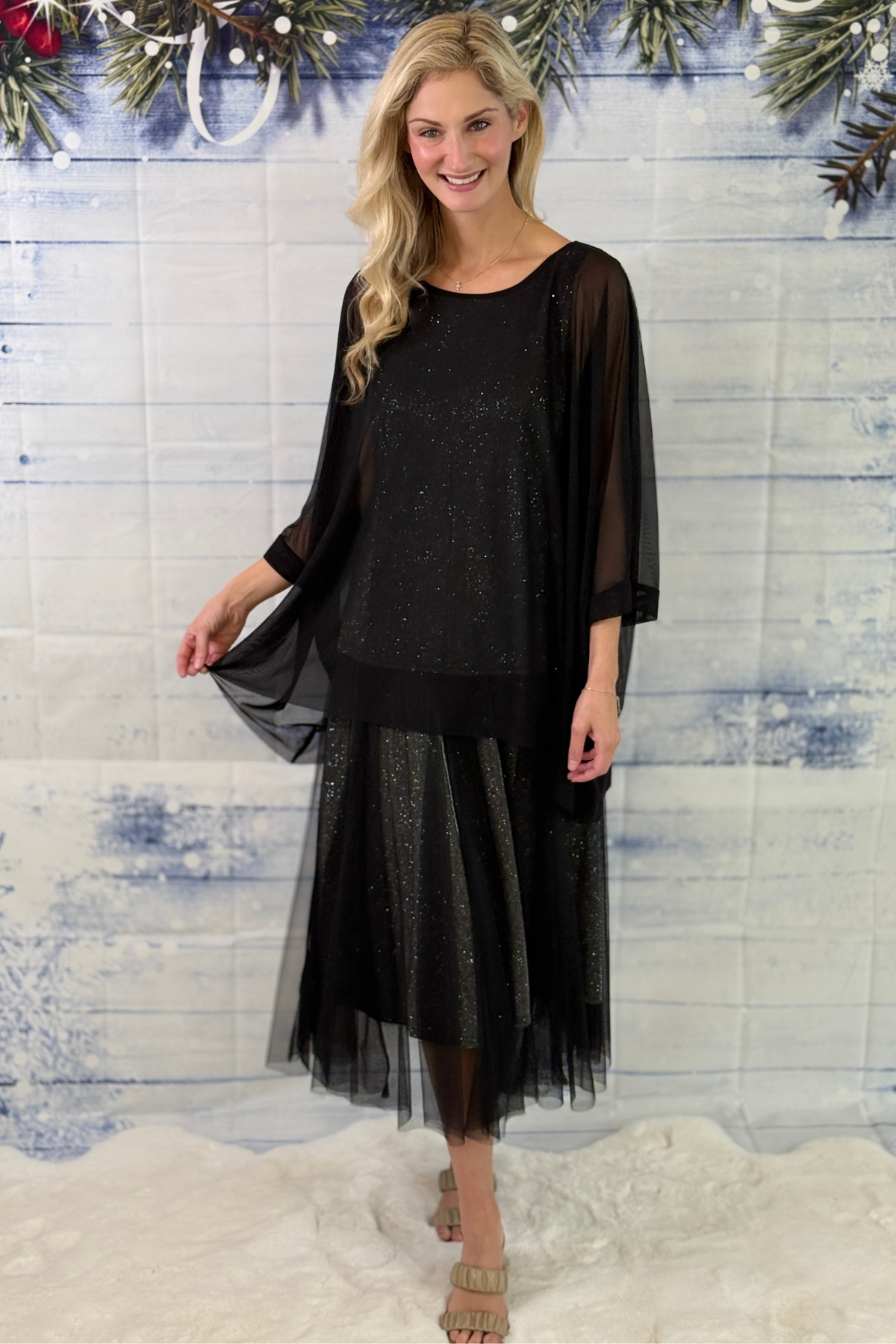 Women’s black holiday party skirt with sheer mesh overlay