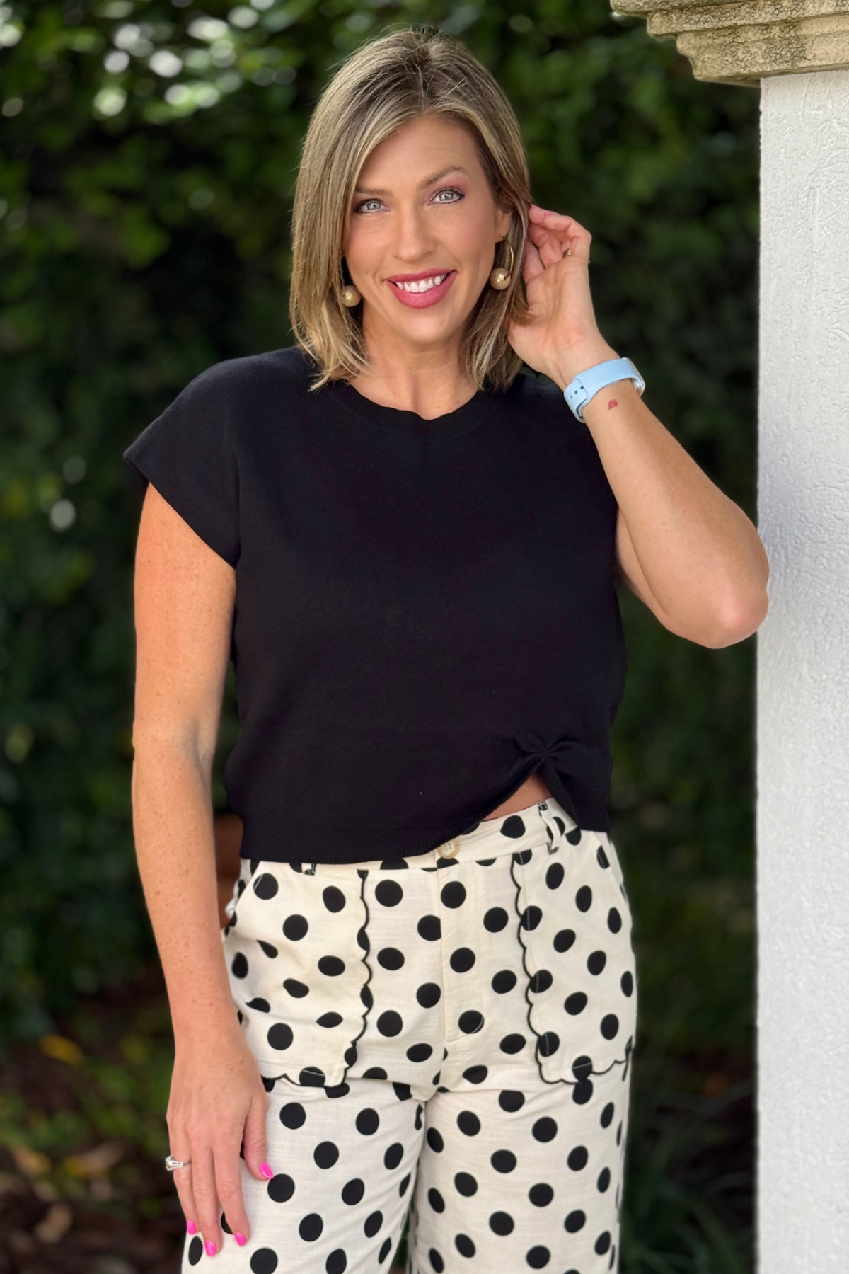 Black lightweight knit sweater top with front knot detail