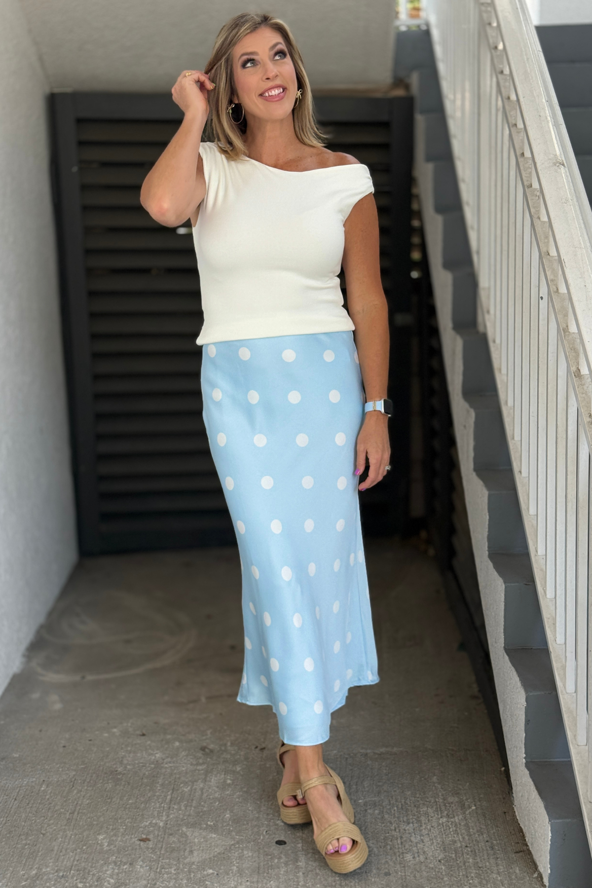 Light blue satin midi skirt with white polka dot print