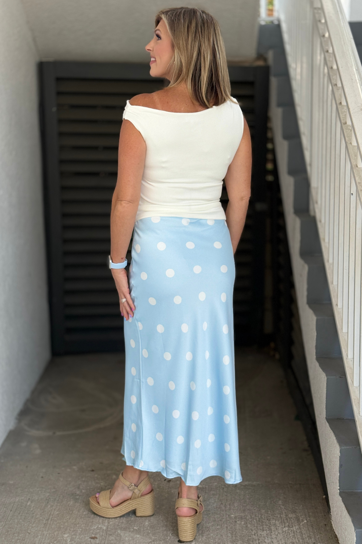 Flowing blue and white midi skirt styled with a white top