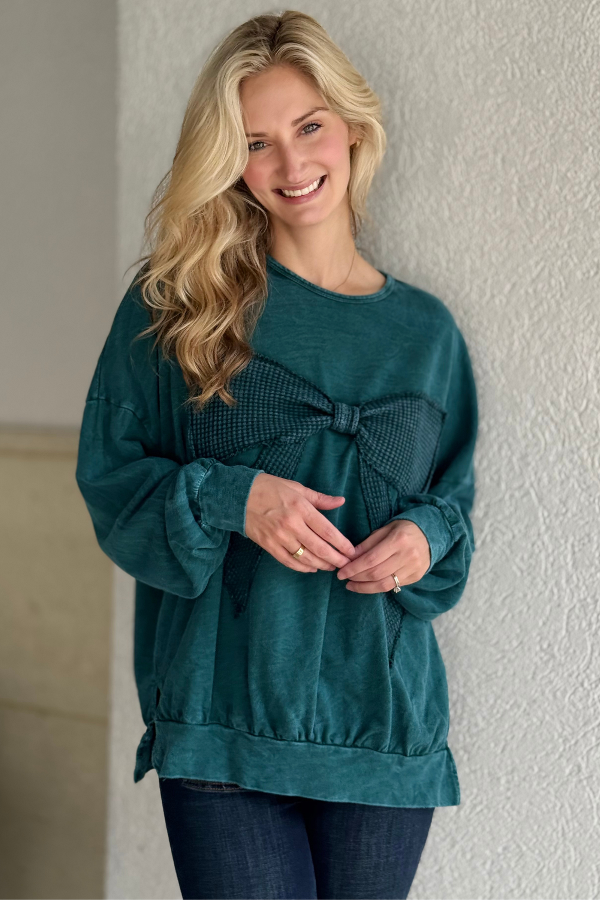 Close-up of waffle knit bow detail in Midnight Green