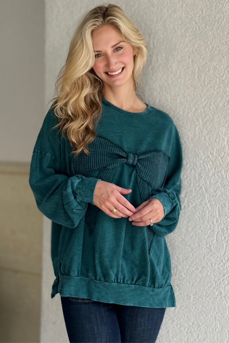 Close-up of waffle knit bow detail in Midnight Green