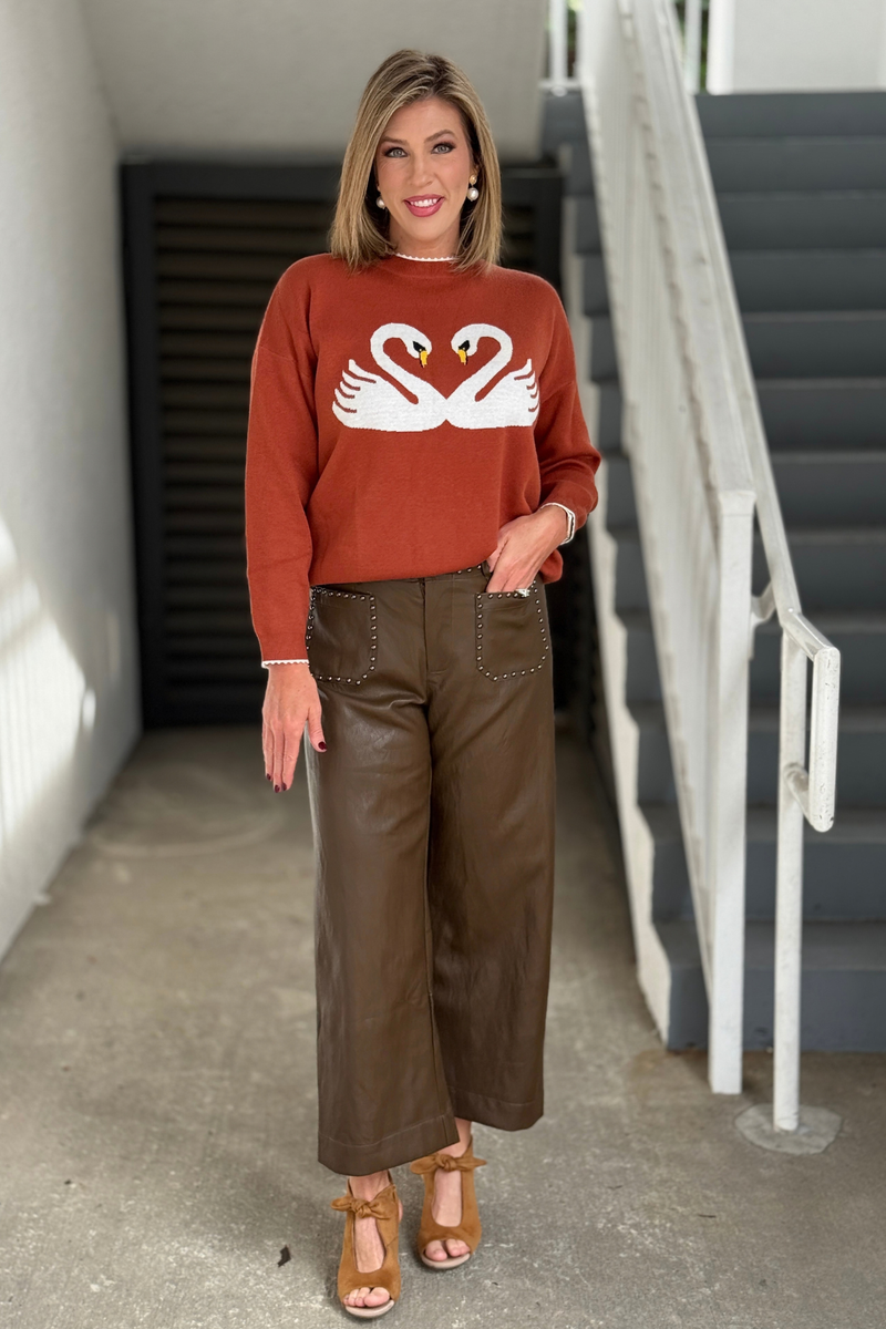Women’s brown faux leather pants with studded front pockets  