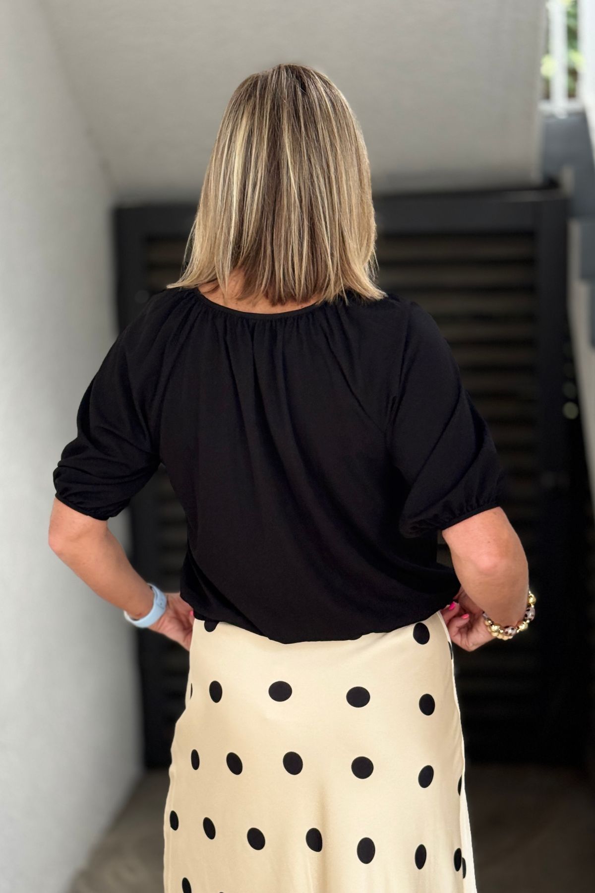 Black V-neck blouse with puff sleeves