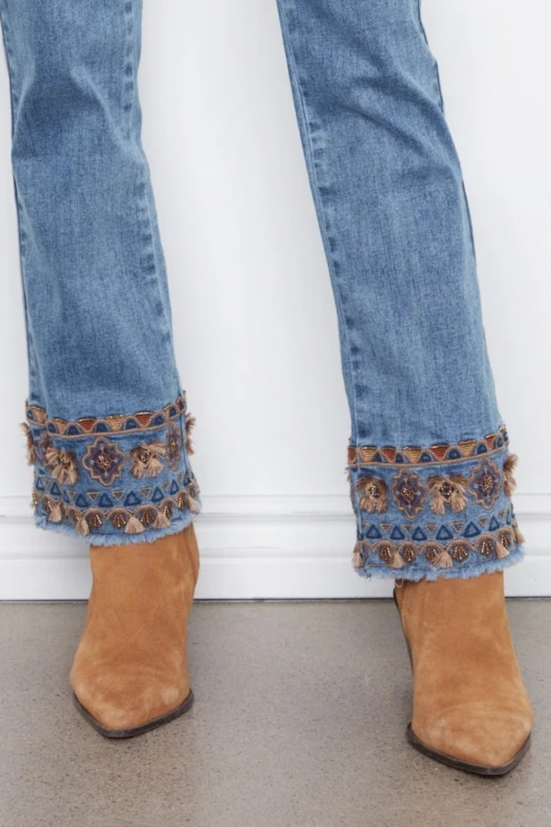 Women’s medium blue flare jeans with embroidered hem detail
