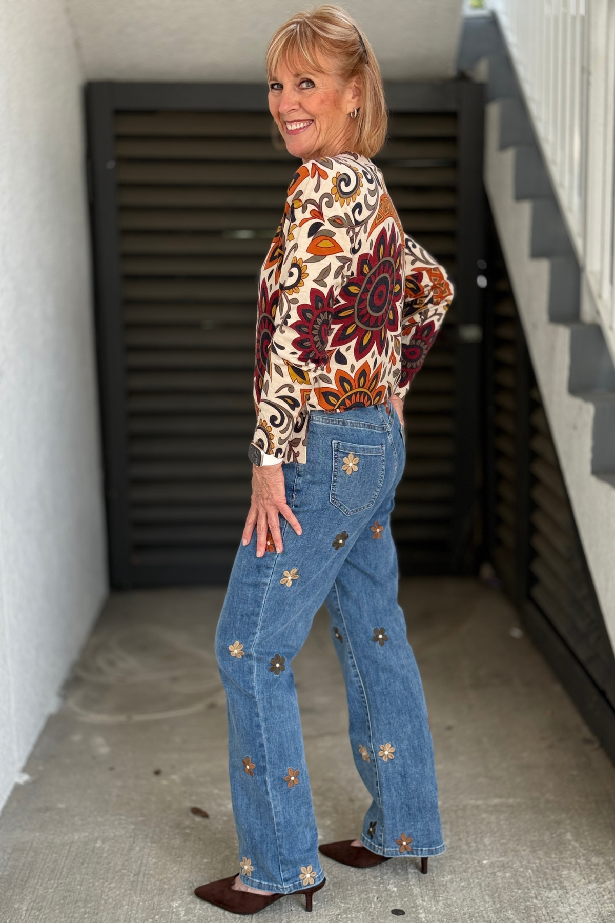 Indigo floral embroidered Charlie B jeans styled with mocha top