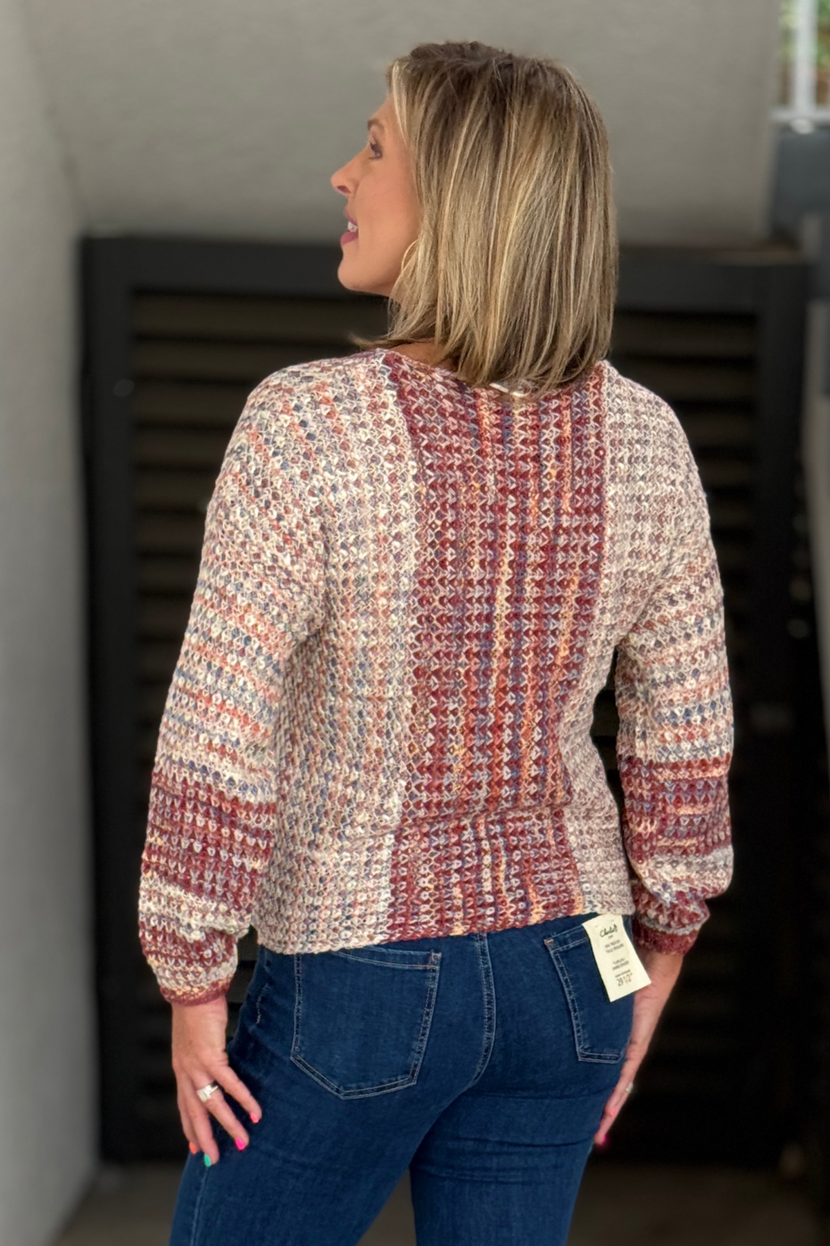 Charlie B V-neck multicolor sweater styled with denim