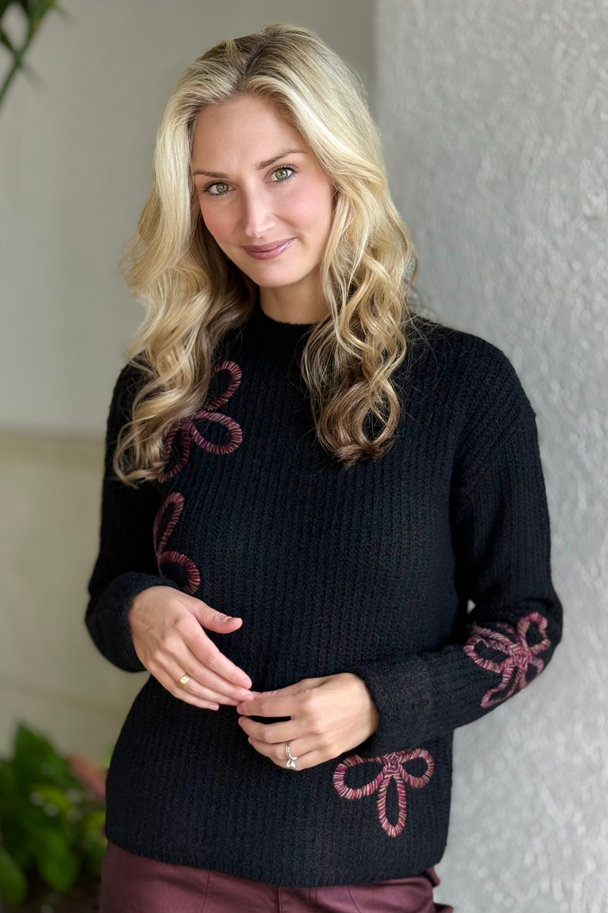 Charlie B Mock Neck Floral Soutache Sweater in black with burgundy floral detailing.