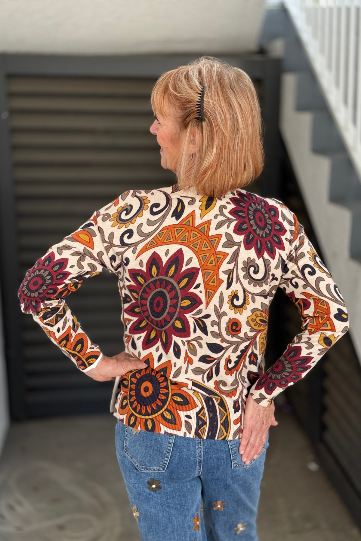Charlie B printed sweater styled with floral embroidered jeans