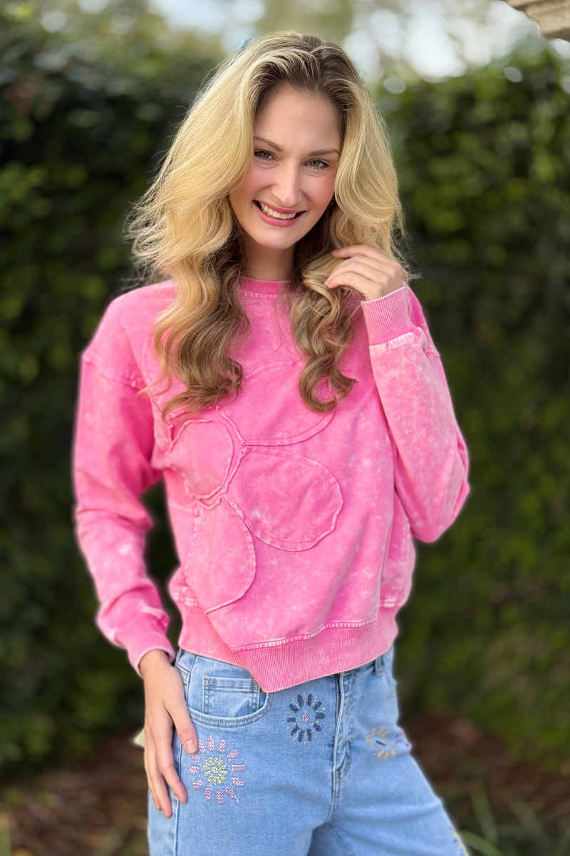 Women’s pink long sleeve top with floral applique