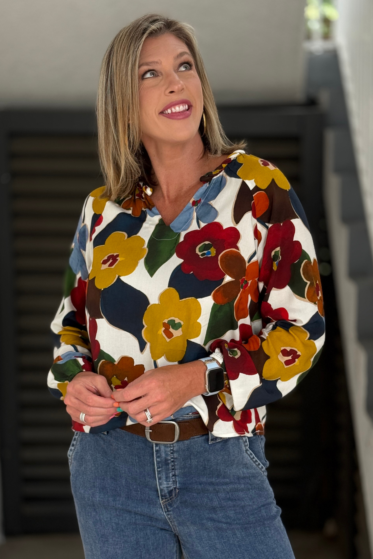 Multicolor floral blouse styled with blue denim