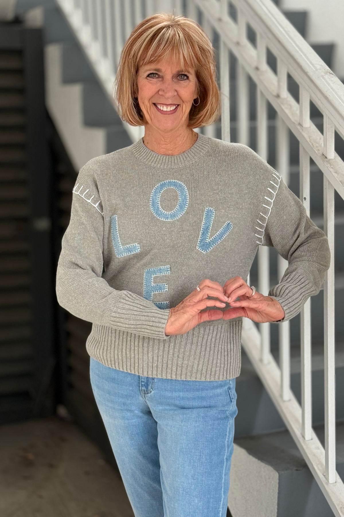 Grey Charlie B sweater with denim LOVE appliqué lettering
