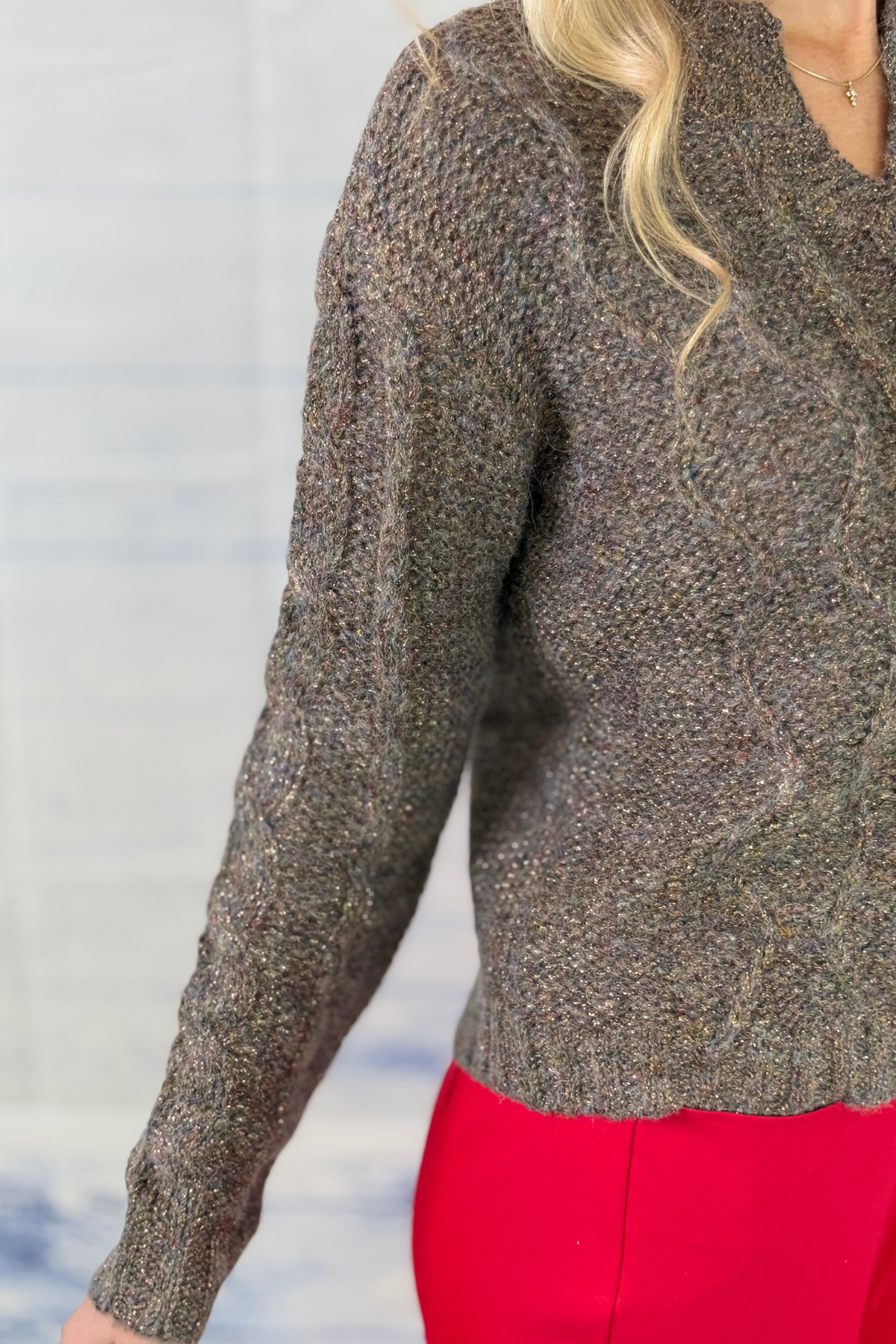 Charlie B women’s metallic sweater styled with red pants