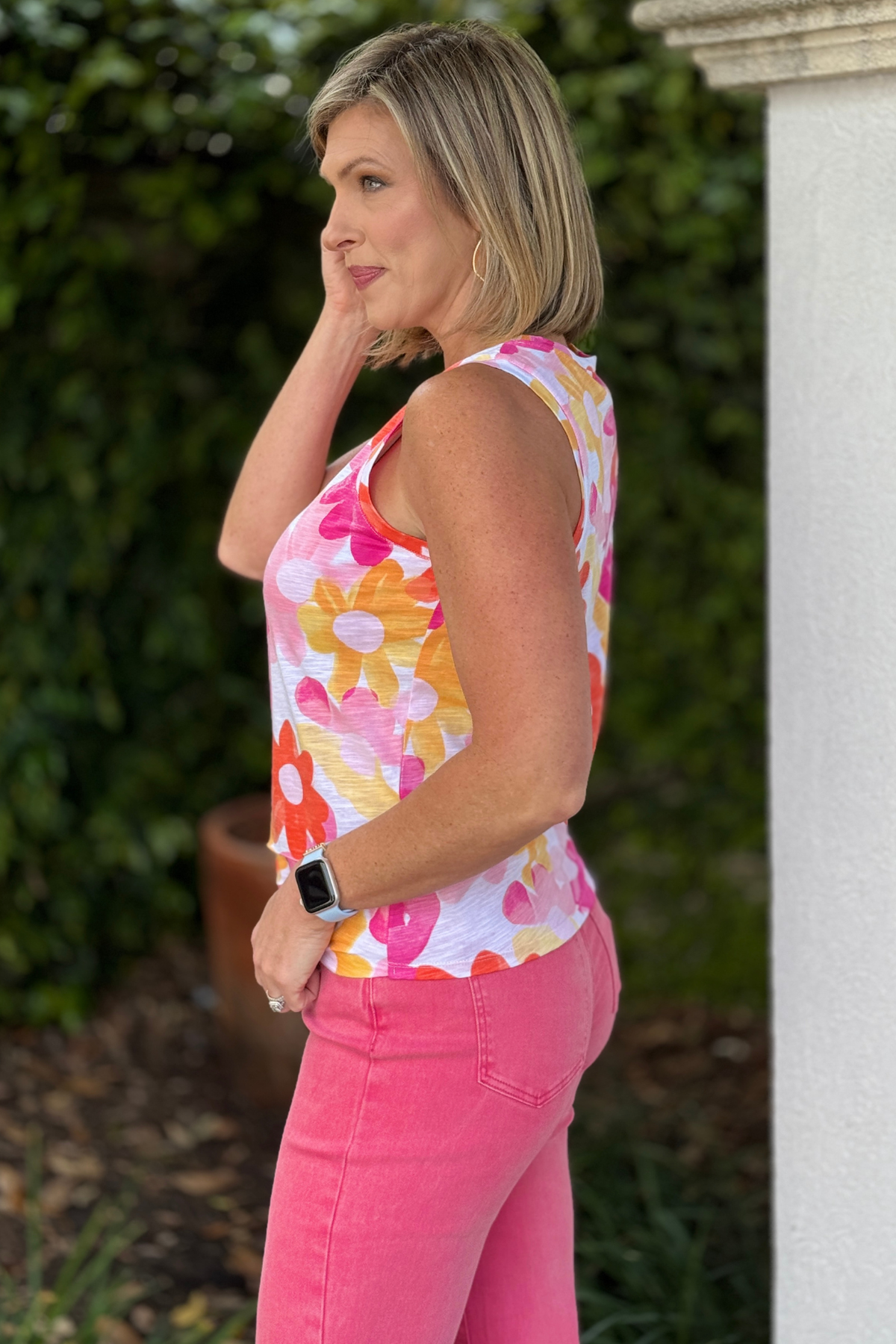 bright summer tank styled with pink jeans