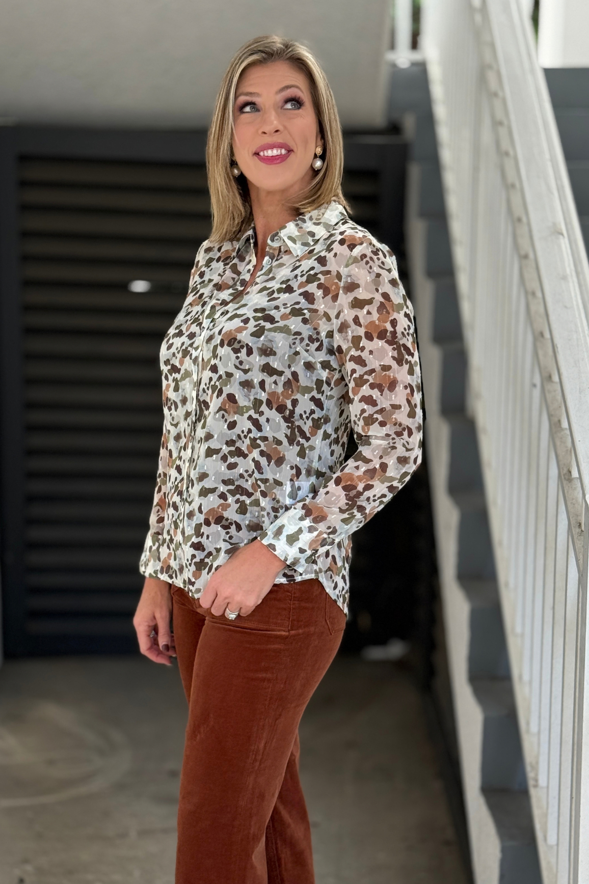 Pebble print blouse styled with rust corduroy pants