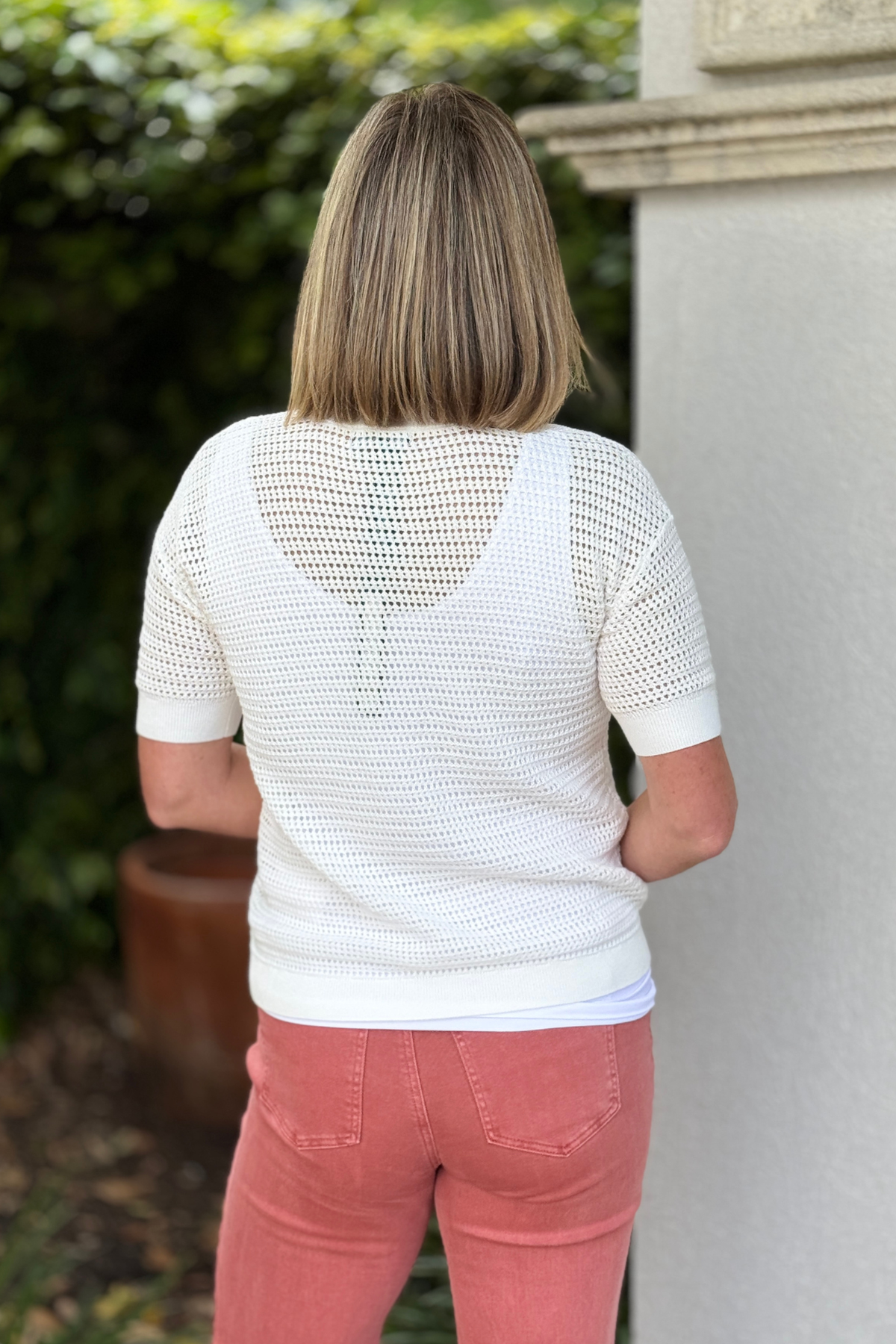 Women’s boutique white open knit top with relaxed fit