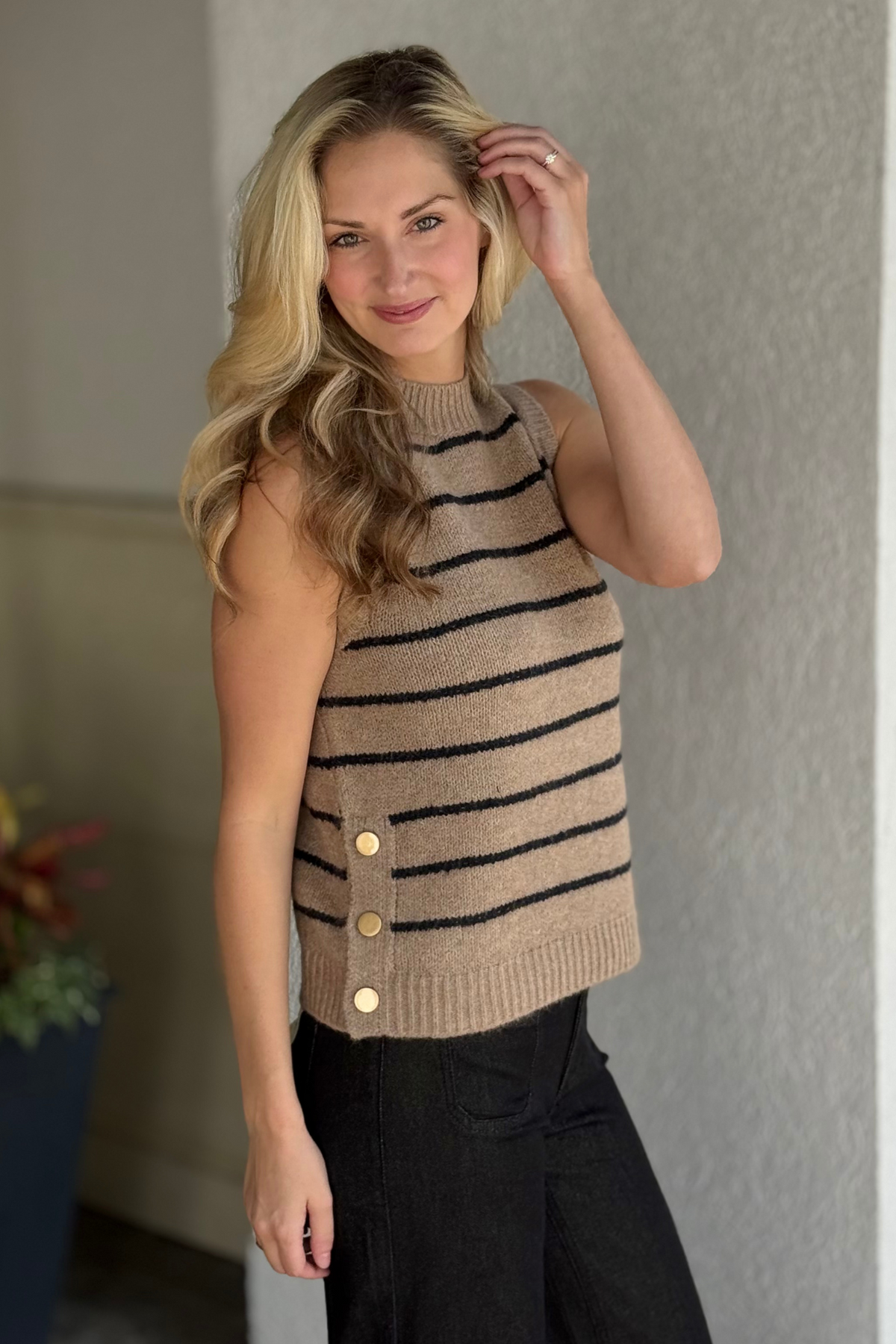 Side view of Charlie B Heather Camel sweater vest styled for fall layering