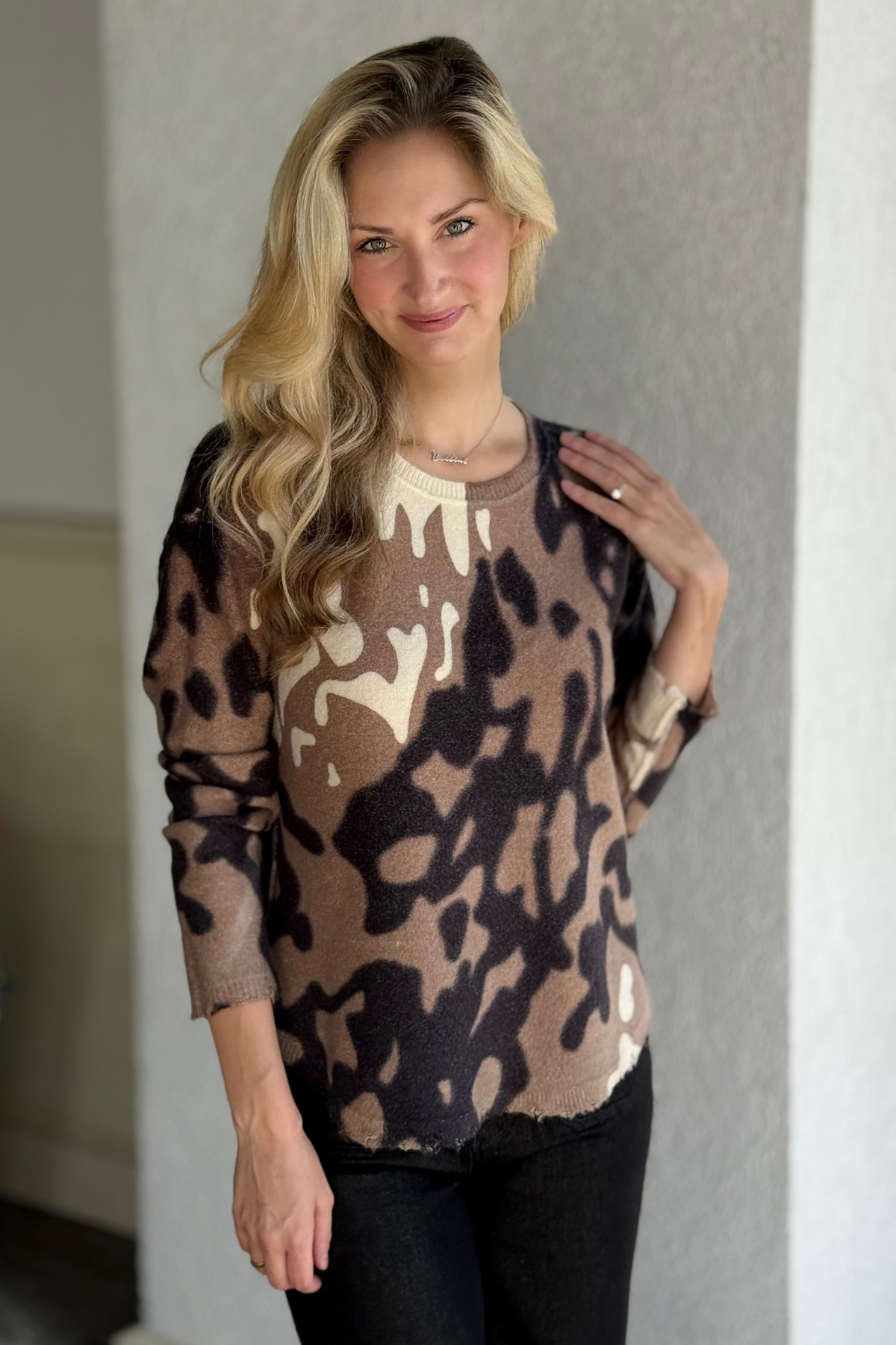 Versatile reversible sweater in soft plush knit, spotted print front and neutral reverse