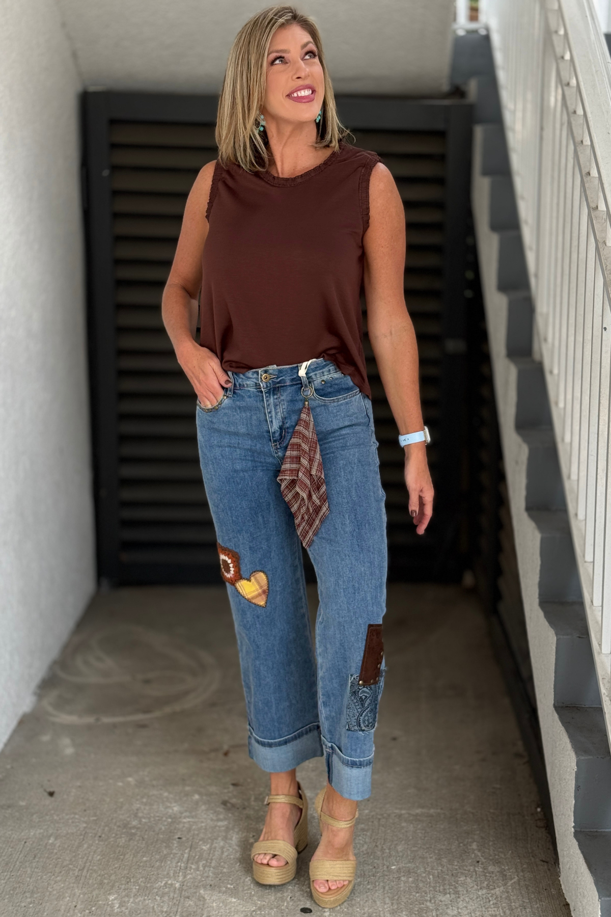 Women’s cuffed Charlie B jeans with patch and stud details